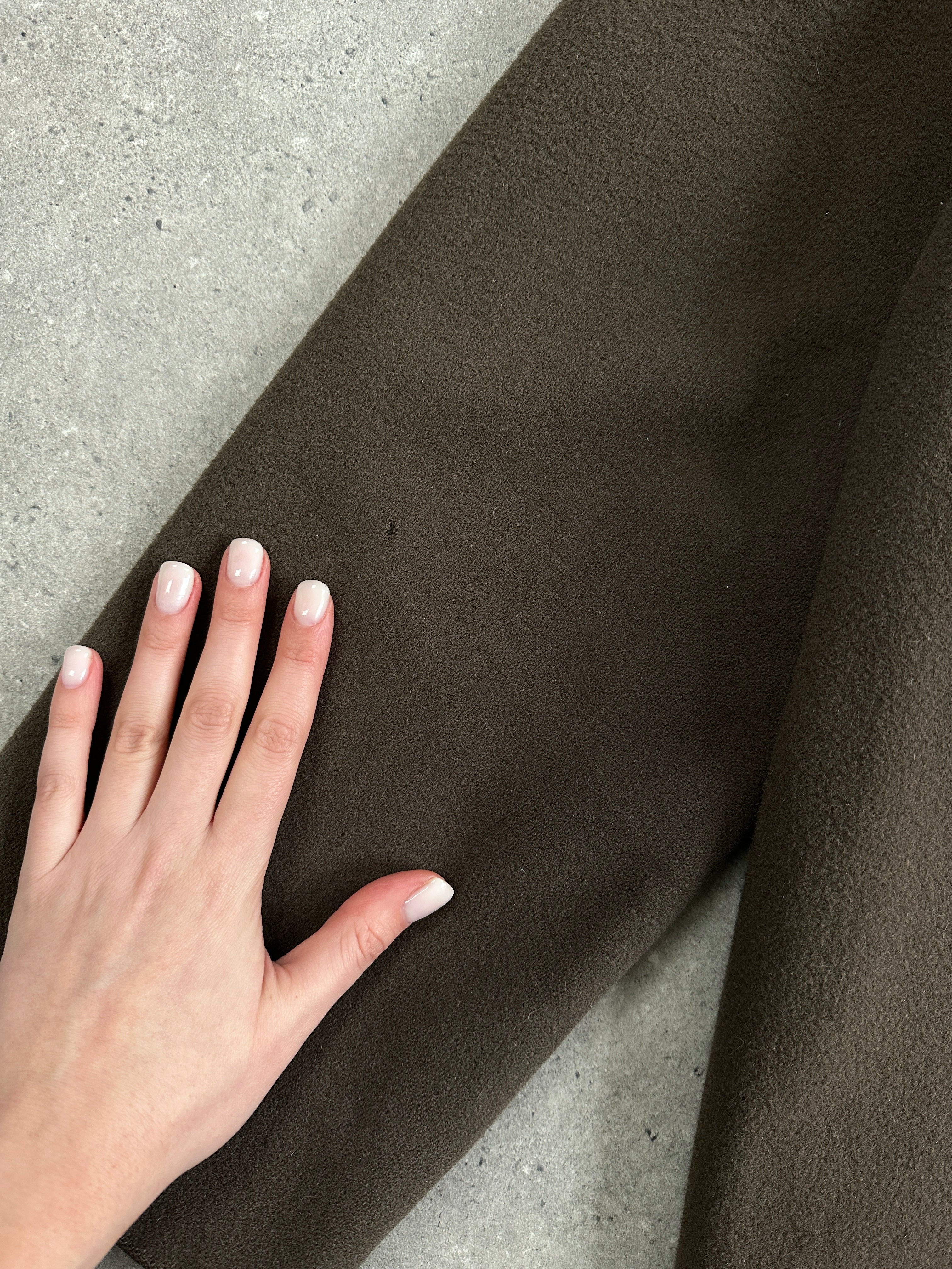 Aquascutum pure new wool coat in size M, classic tailored coat with a smooth finish and elegant design, displayed on a neutral background.