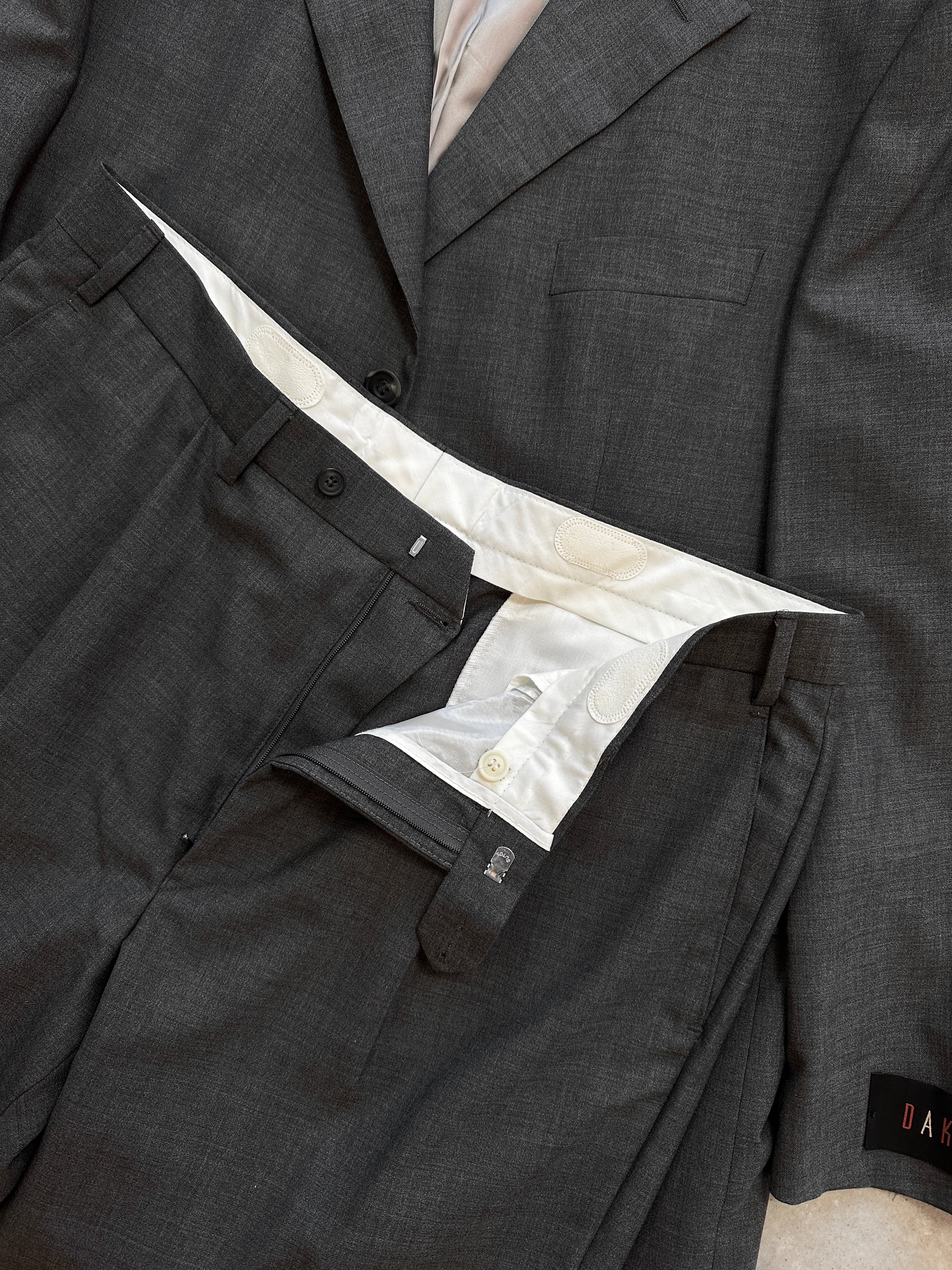 Vintage pure wool single-breasted suit jumpsuit in size 44R/W36, tailored with classic lapels and a fitted silhouette.