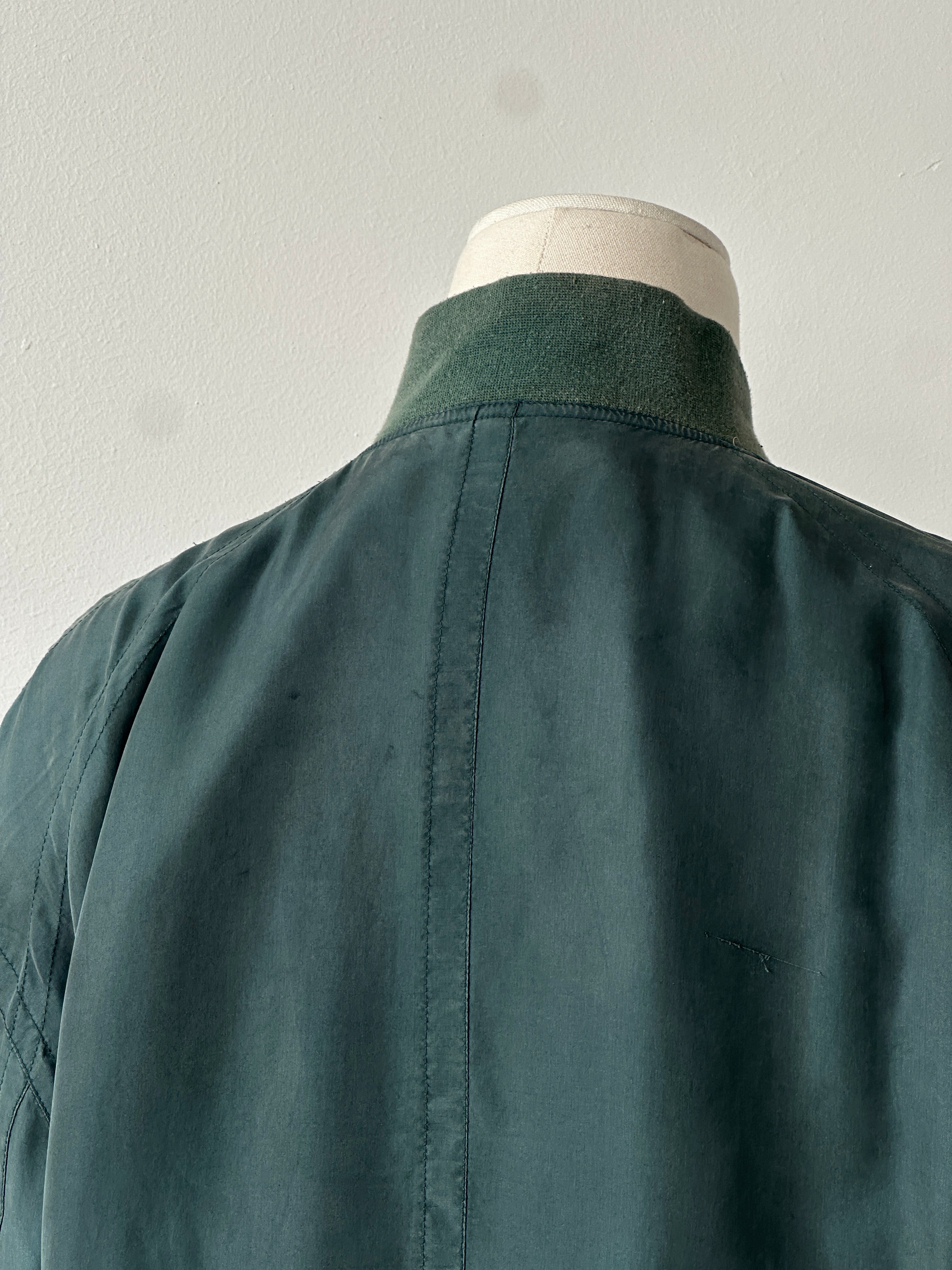 Vintage 1990s pure silk bomber jacket in size M, featuring a classic retro design with a smooth silk finish.