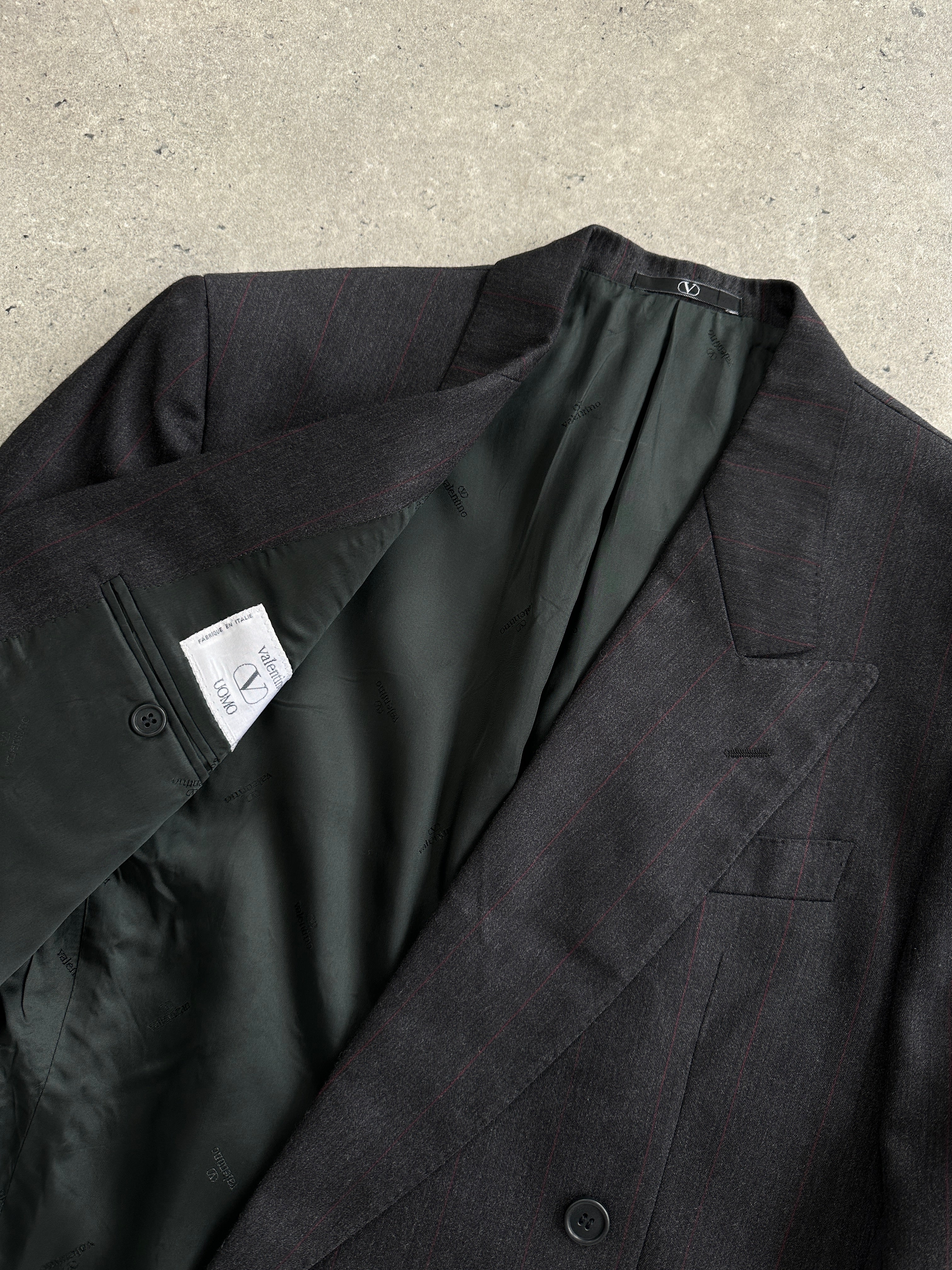 Valentino virgin wool double-breasted blazer in size 36R/S, tailored fit with classic lapels and structured design.