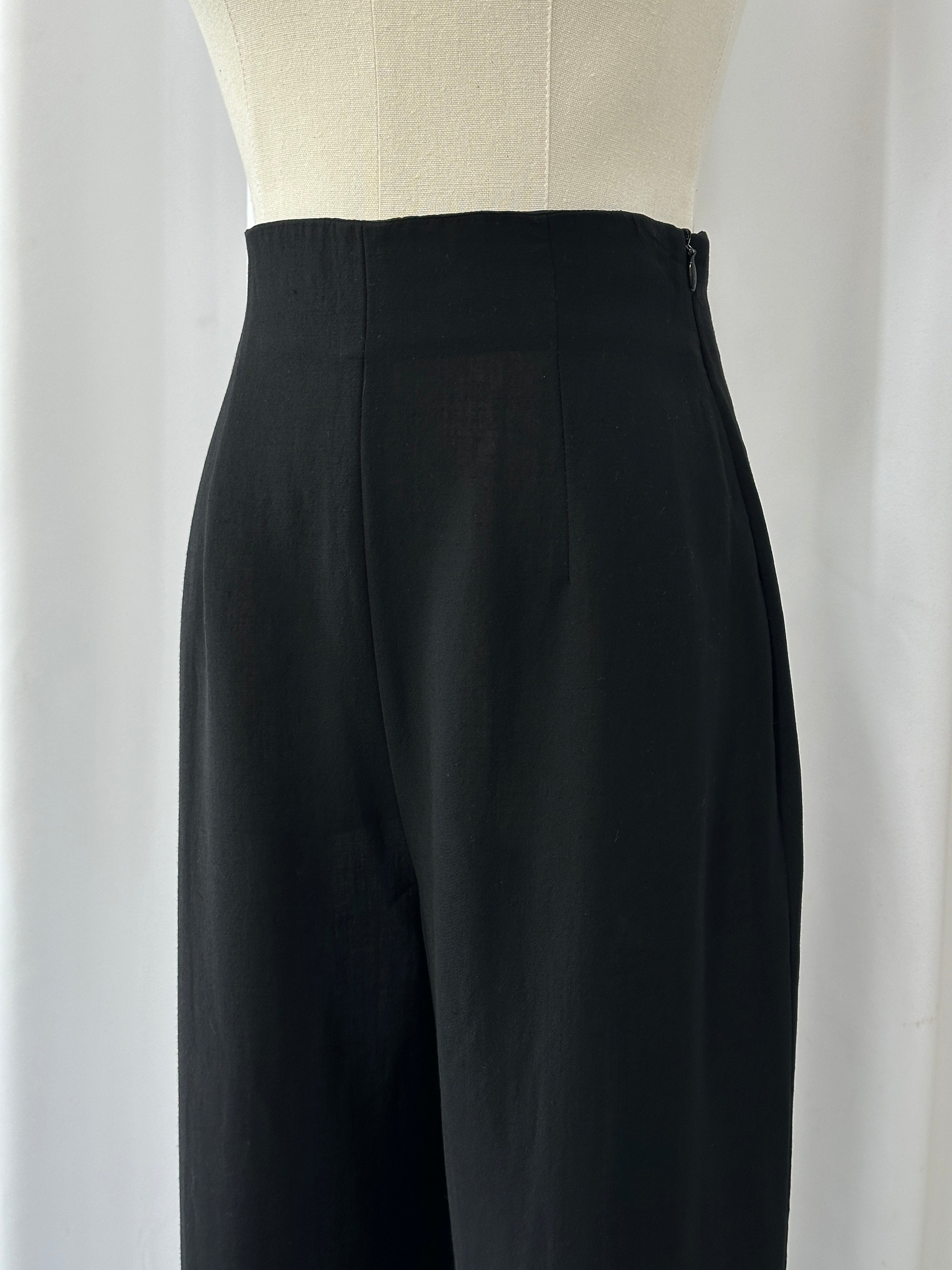 Max Mara 1990s wool high-waisted straight leg tailored trousers in W24, shown on a hanger with a neutral background.