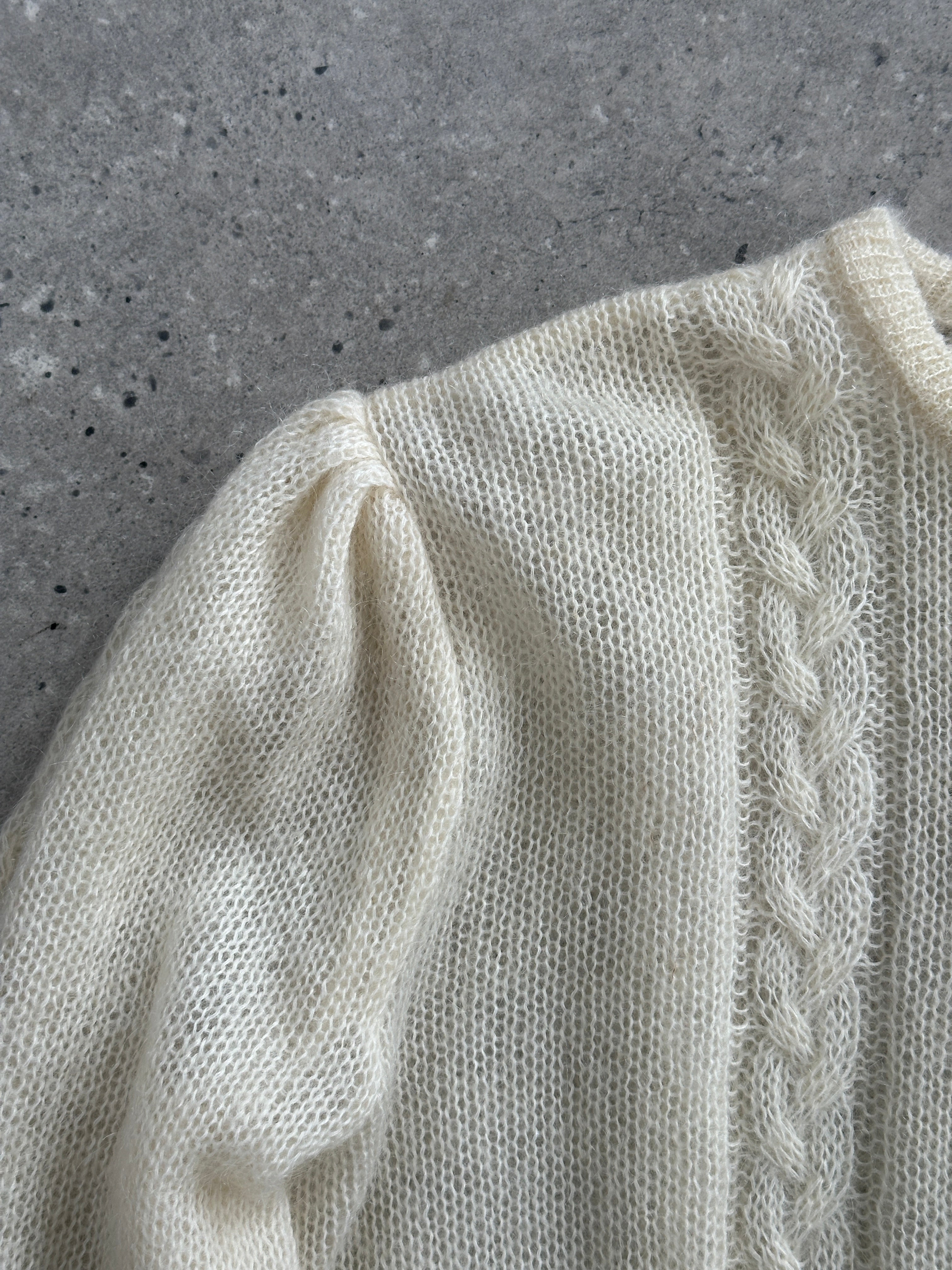 Vintage wool mohair cardigan in size L, featuring a cozy knit design and classic style, displayed on a hanger.