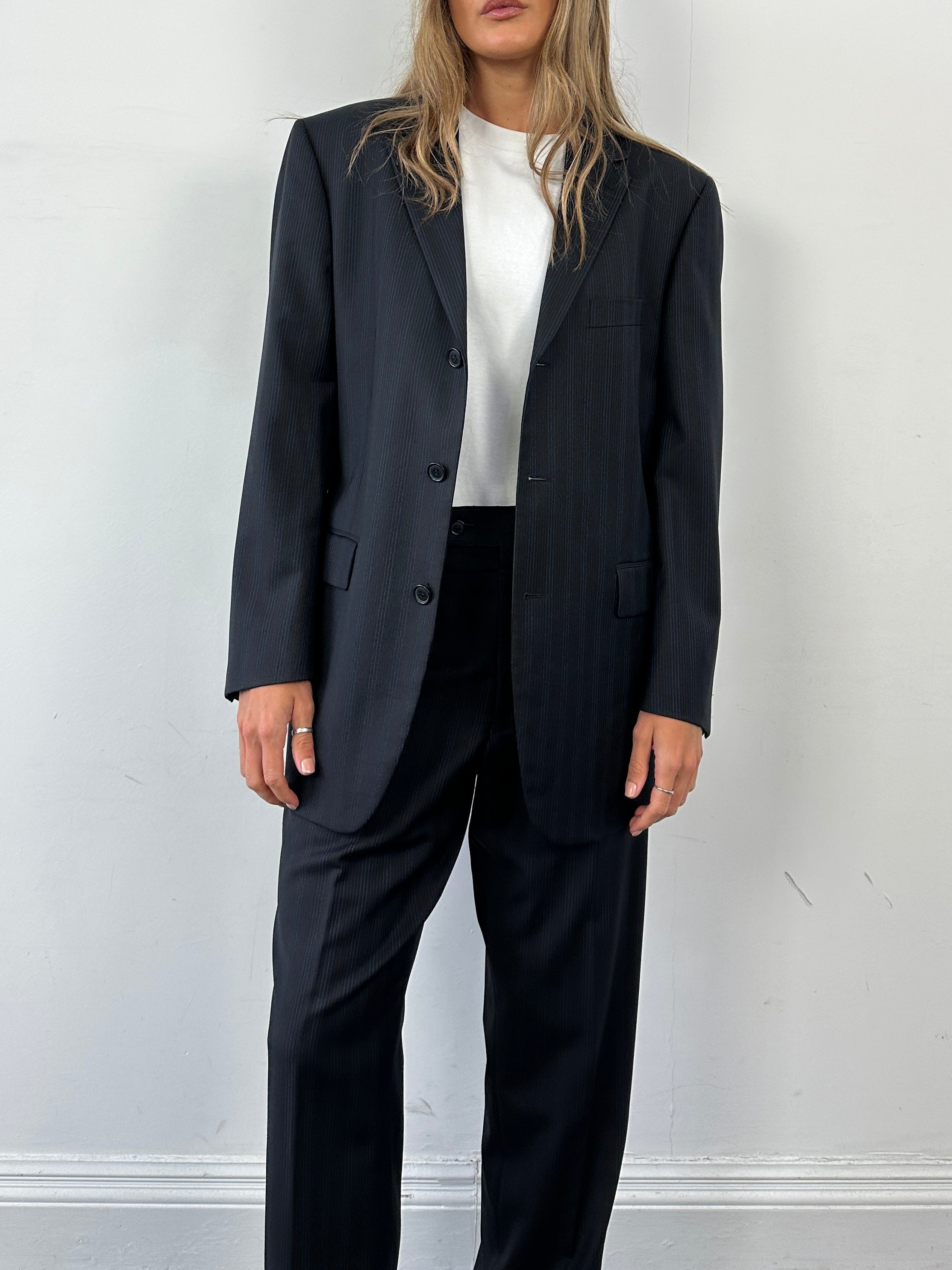 Yves Saint Laurent pinstripe pure wool single-breasted jumpsuit in size 40S/W32, featuring tailored fit and classic design.