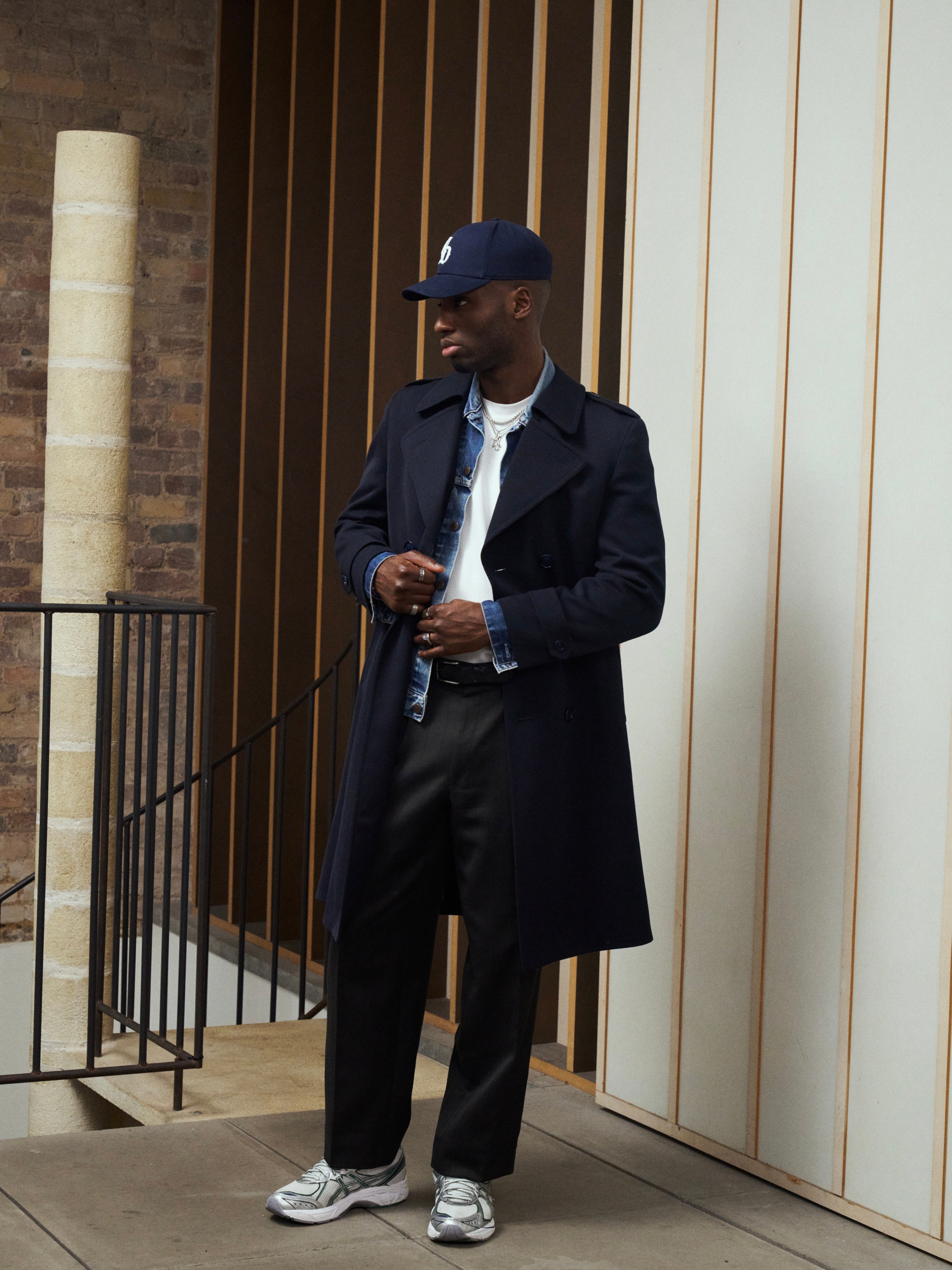 Vintage wool twill belted trench coat in XL, featuring classic design and double-breasted style with a belt at the waist.