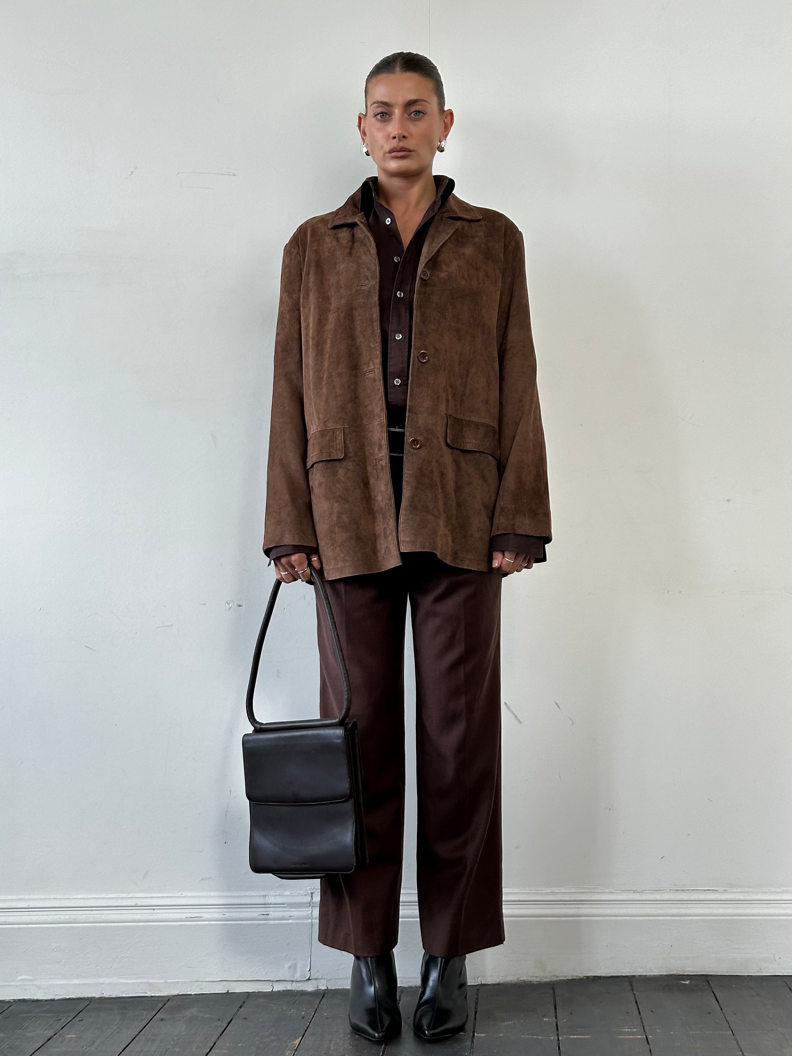 Vintage suede jacket in size large, front view showing classic collar and button details, made by Vintage.