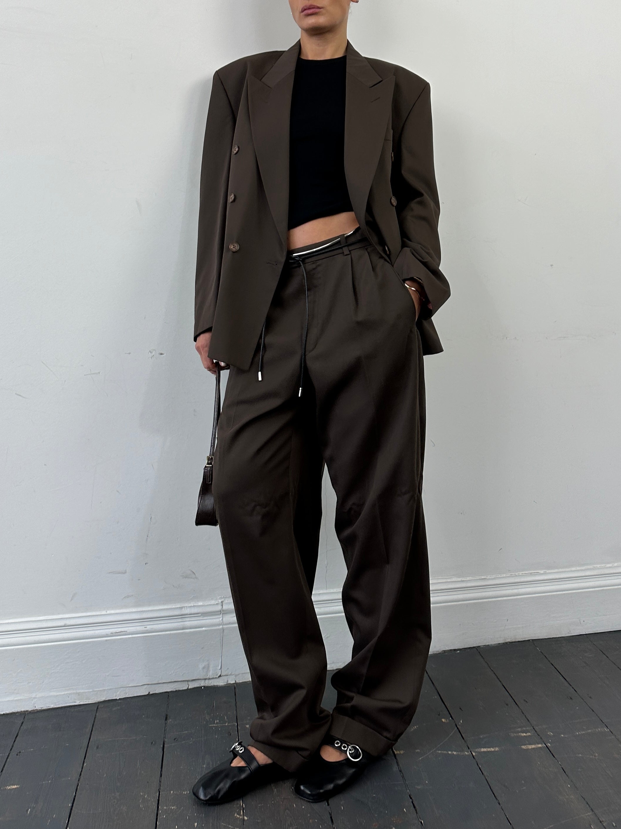 Vintage double-breasted suit jumpsuit in size 40R/W32, featuring classic lapels and tailored fit in a vintage style.
