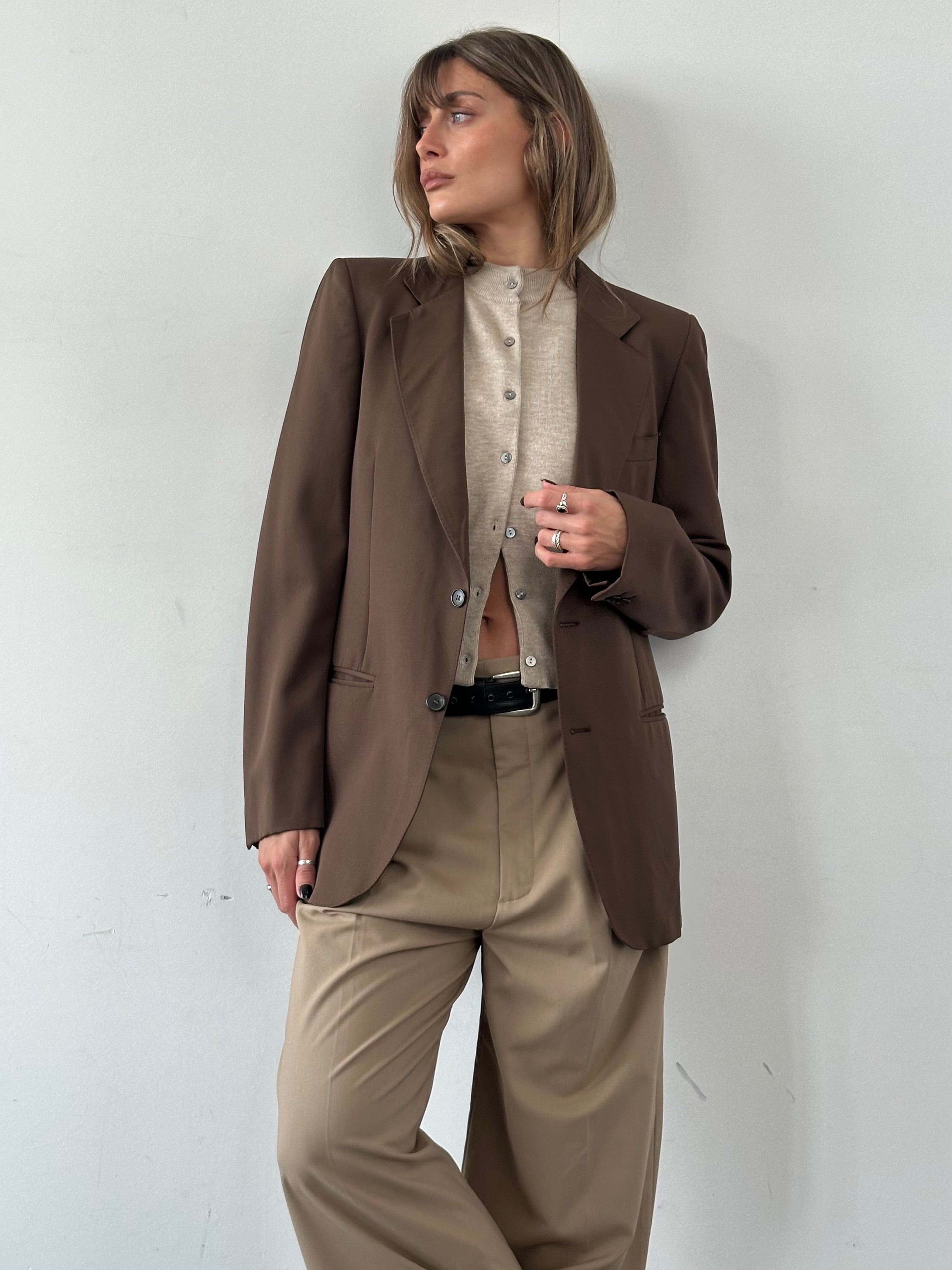 Vintage Italian vintage pure wool single-breasted blazer in size S/M, featuring classic tailored design and natural wool texture.
