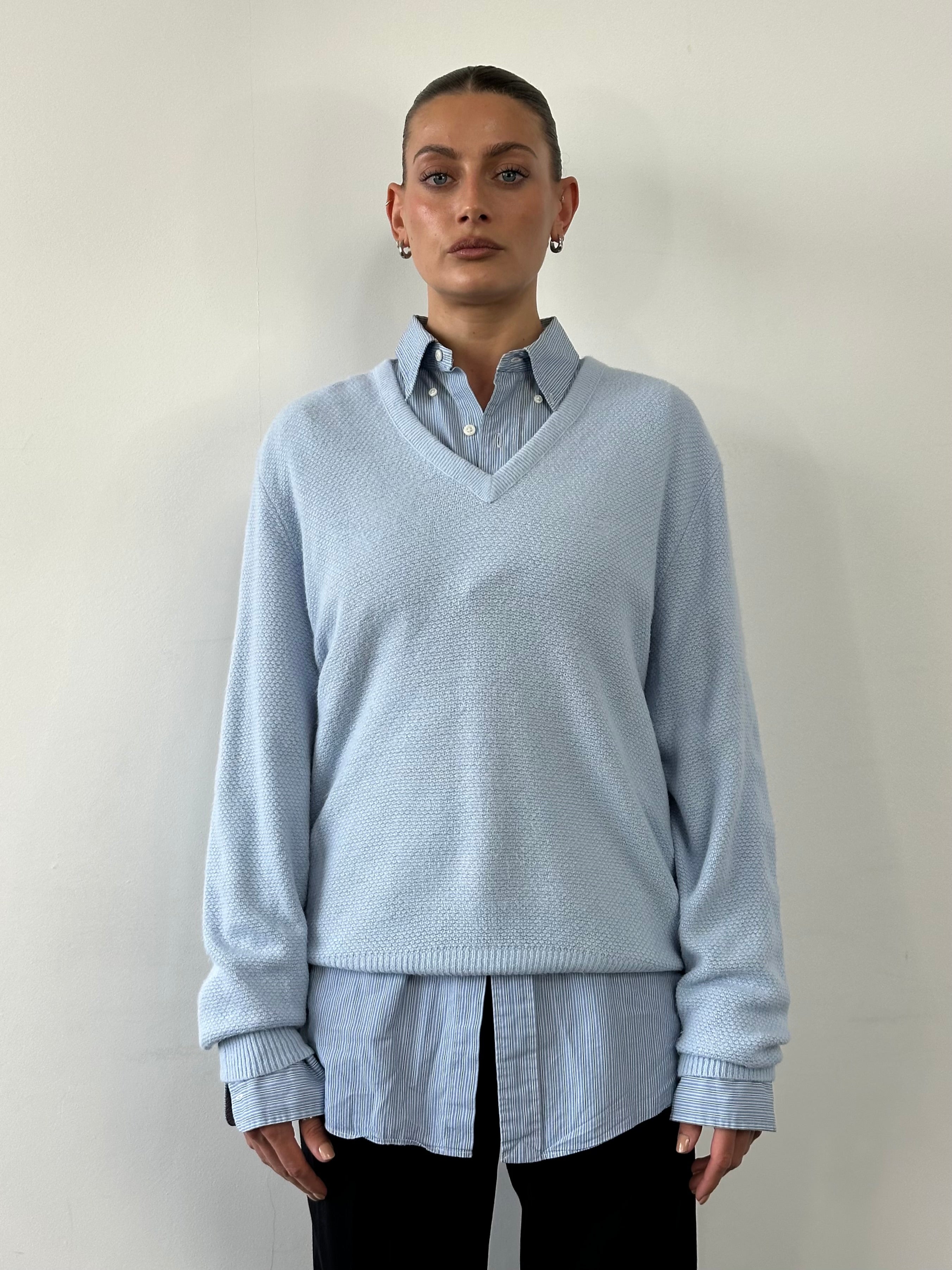 Christian Dior 1980s V-neck logo knitted jumper, in size large, featuring classic Dior branding and cozy knit fabric.
