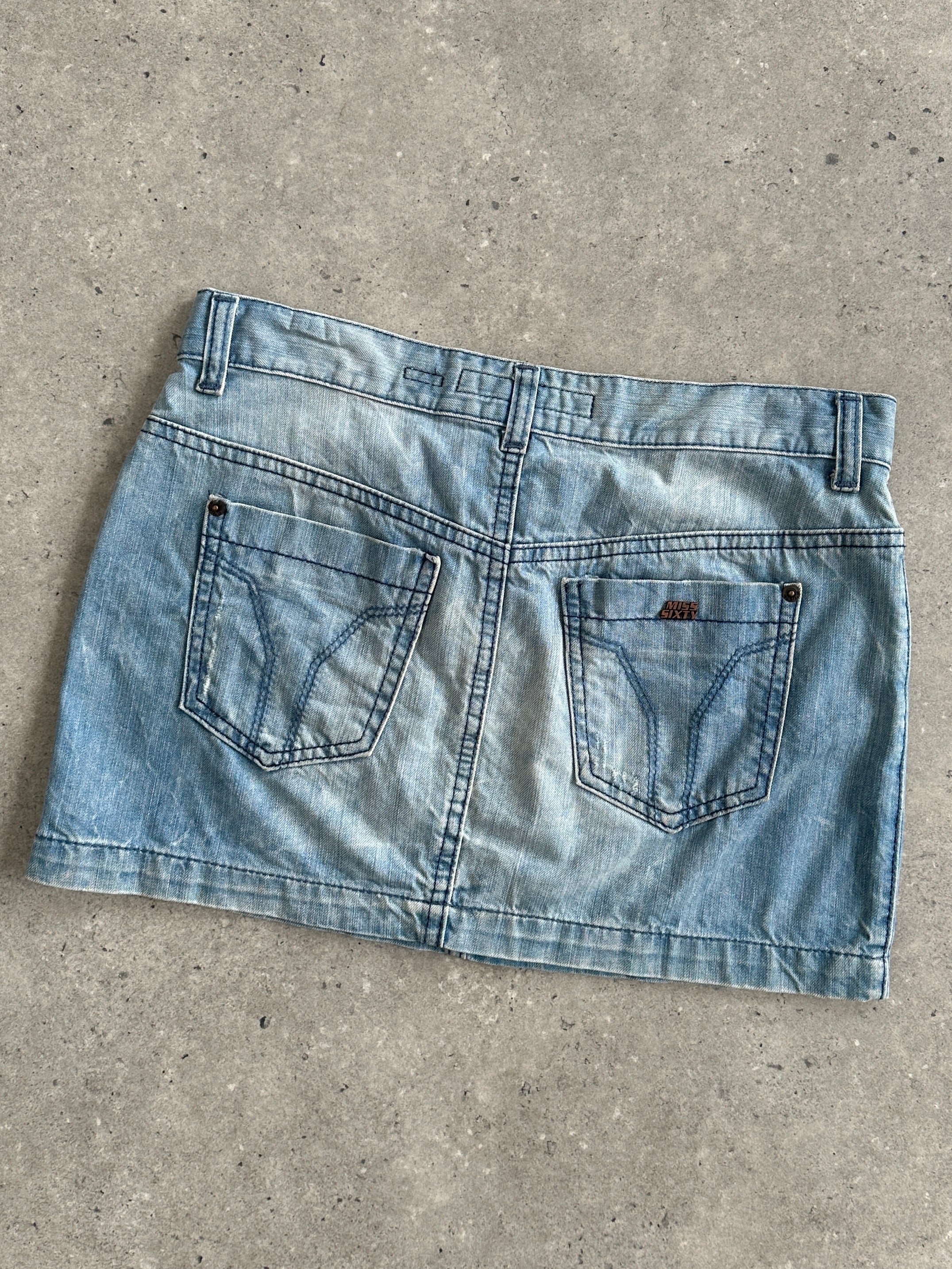 Miss Sixty 2000s denim mini skirt in W30, stylish high-waisted denim skirt with classic blue wash and button front detail.