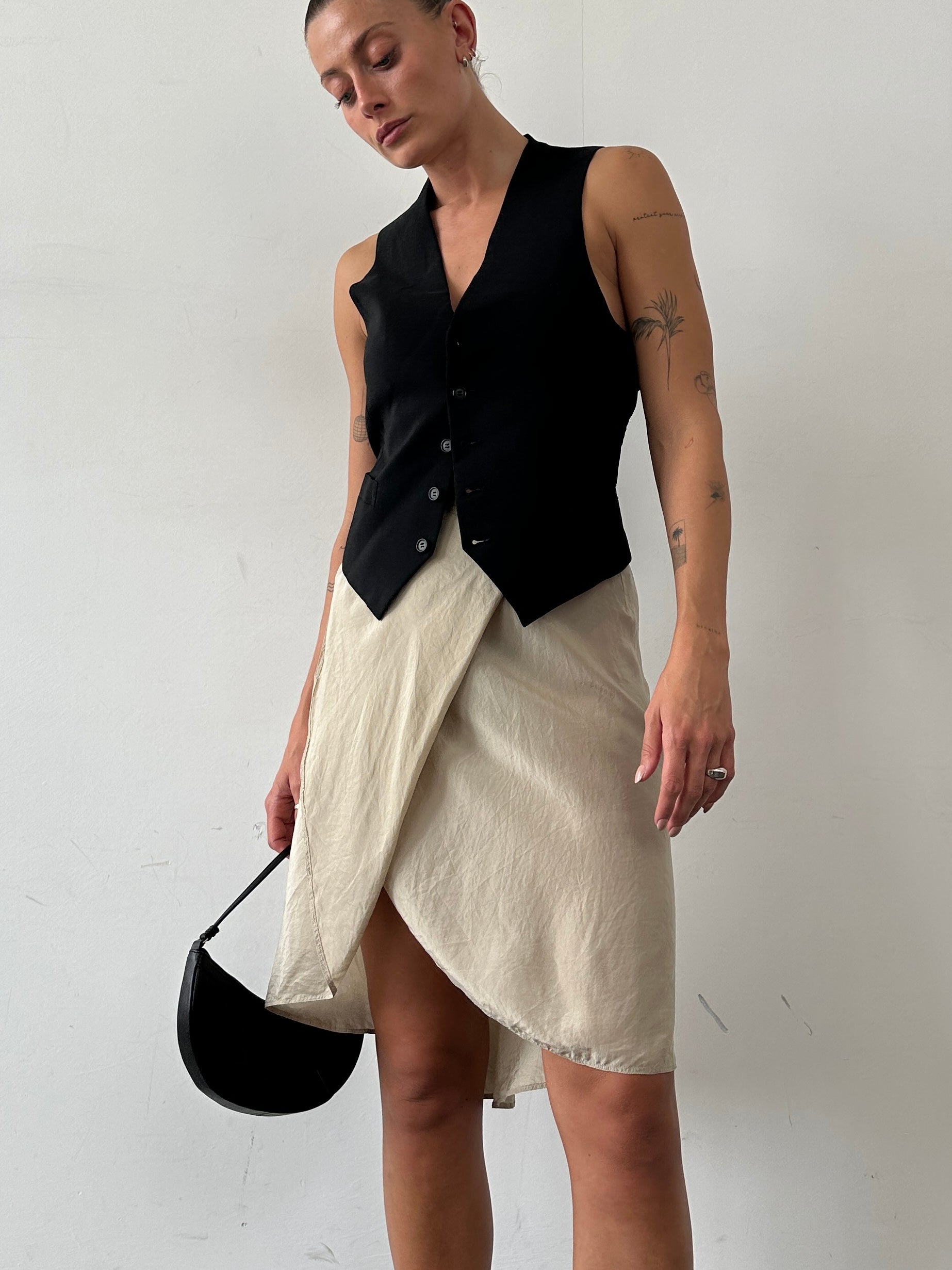 Max Mara pure silk wrap skirt in W27, elegant and lightweight, shown in soft fabric with subtle texture.