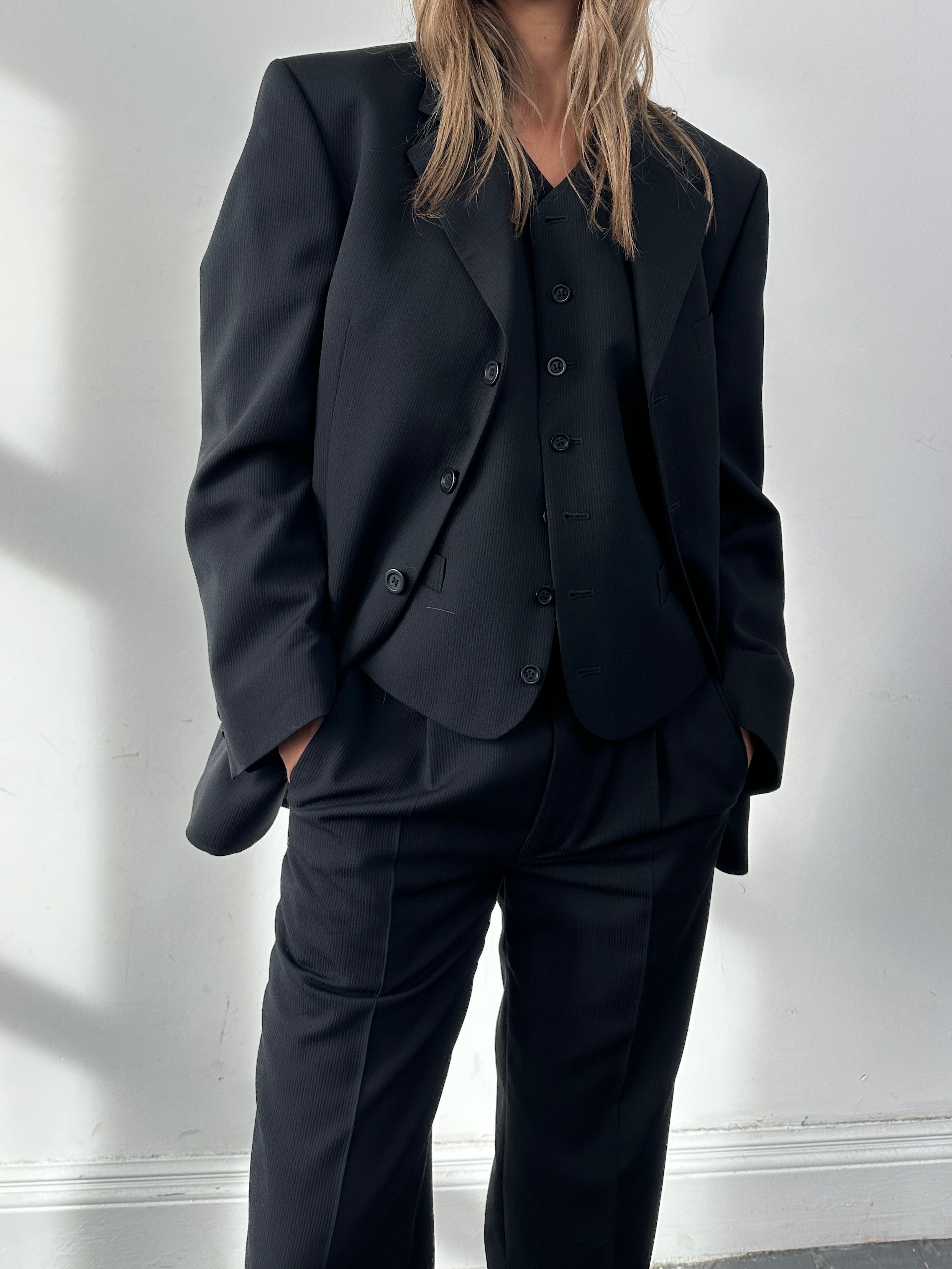 Vintage wool ribbed three-piece suit in size 38R/W30, featuring tailored jacket, vest, and trousers, displayed on a mannequin.