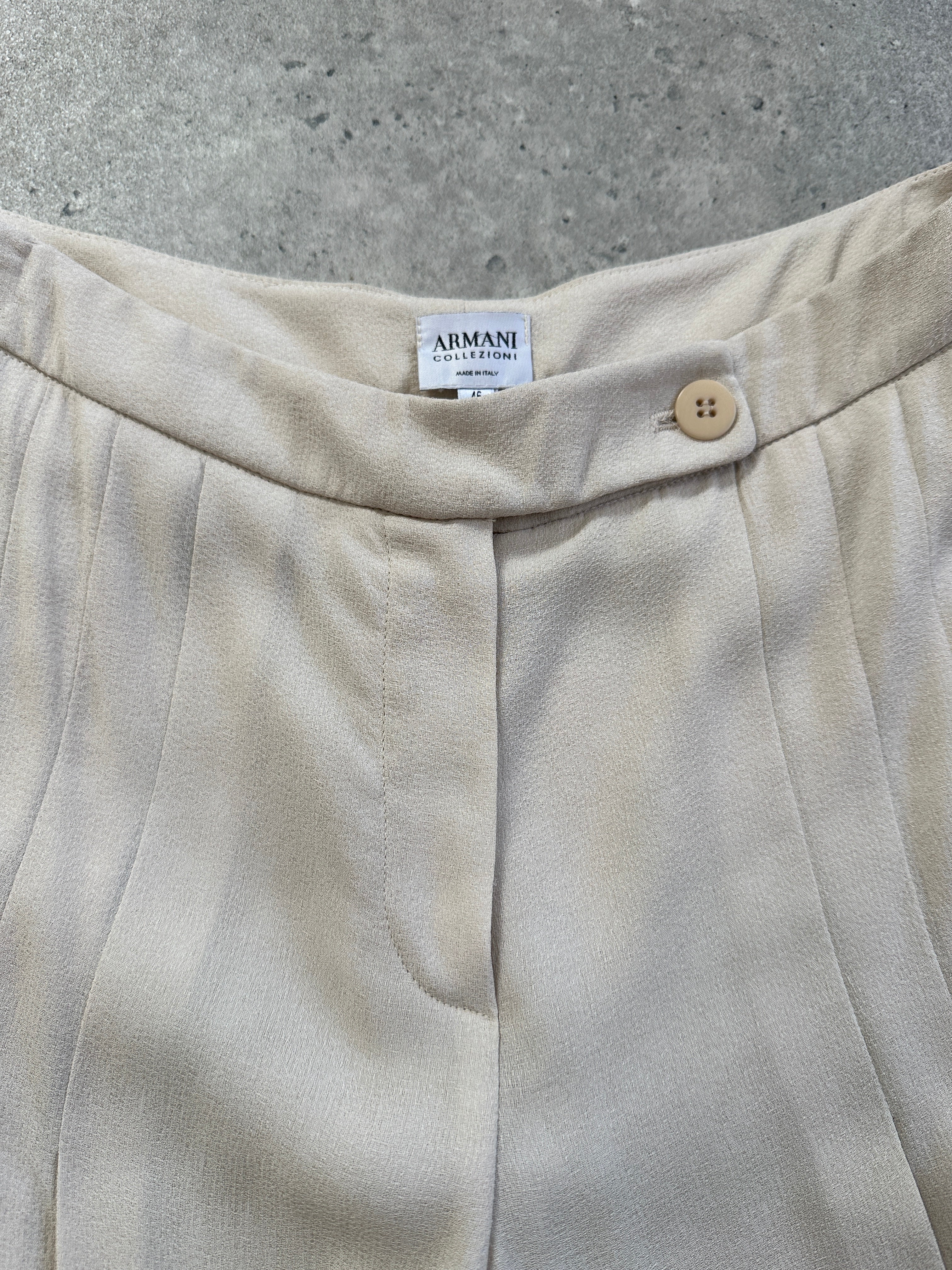 Armani Collezioni 2000s tailored palazzo trousers with pleats and wide legs, size W30, shown on a model.