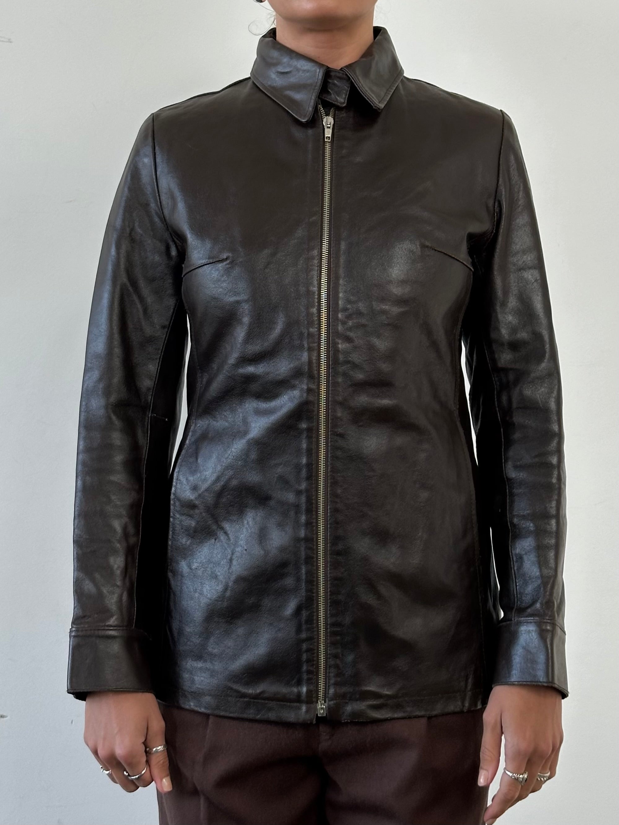 Vintage smooth leather jacket in size small, featuring classic design and premium leather for a timeless look.