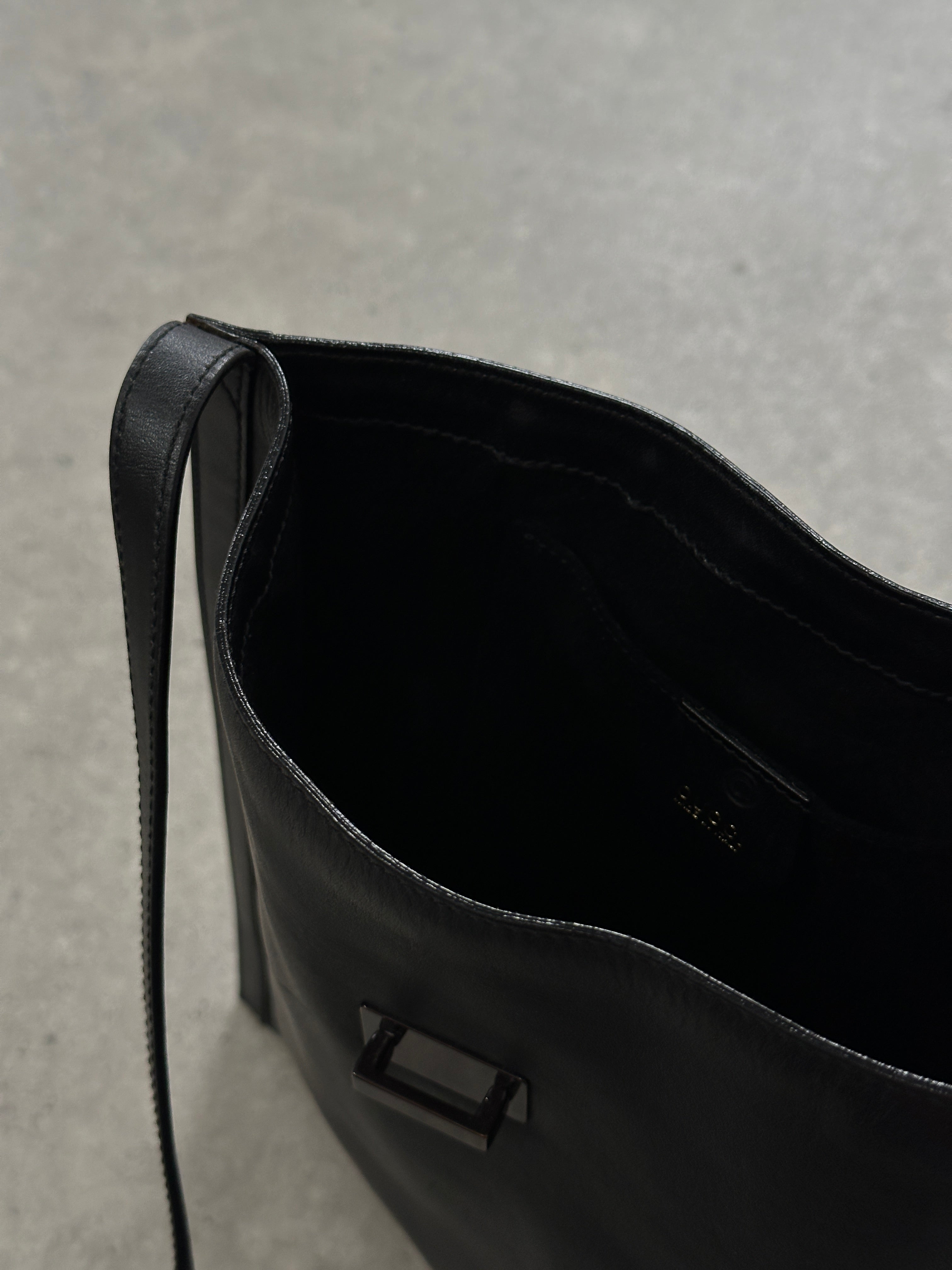 Gucci minimal rectangle leather bag with sleek design, featuring smooth leather and subtle branding on the front.