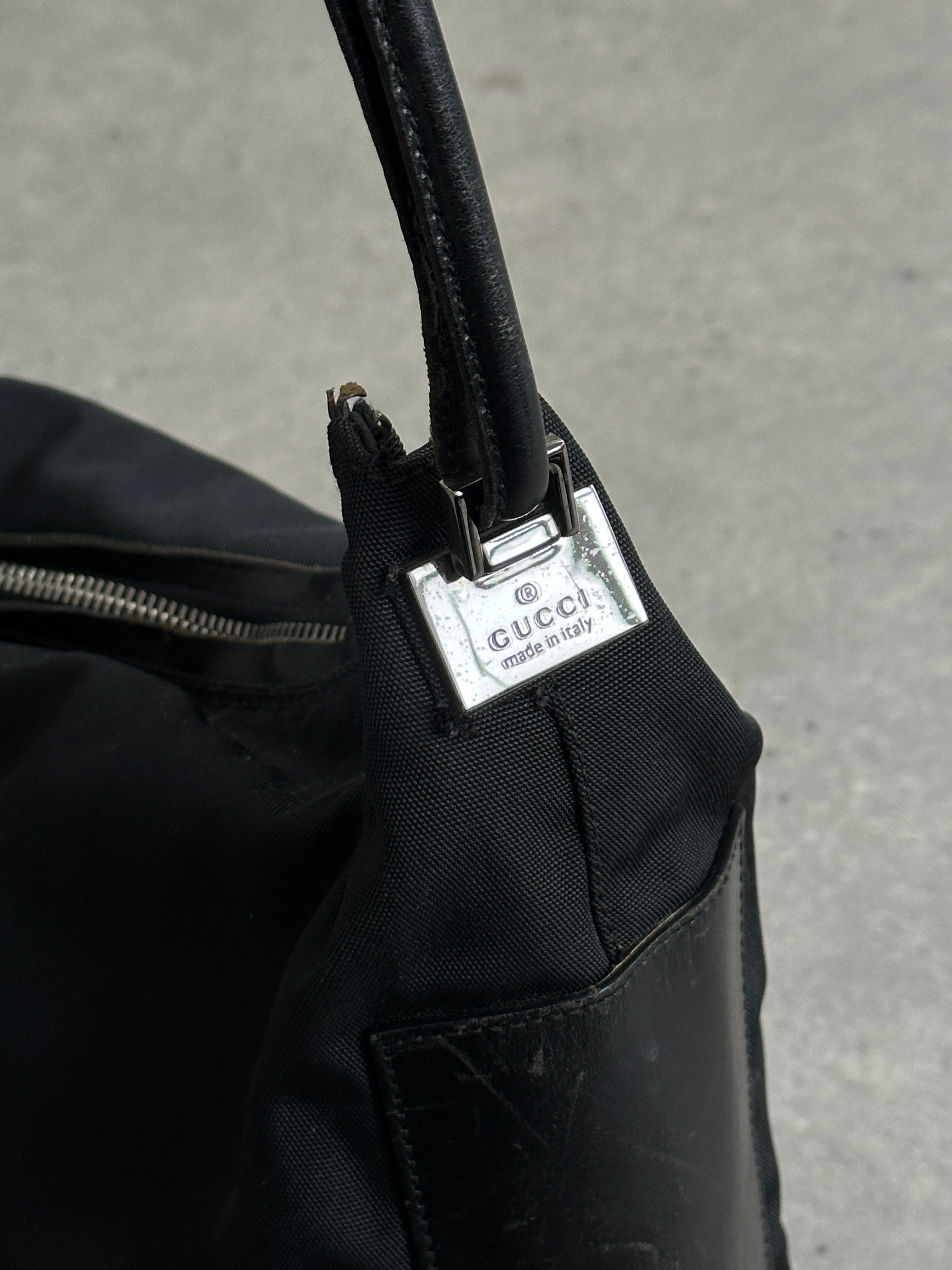 Gucci 1990s Tom Ford canvas and leather hobo shoulder bag with stylish design and spacious interior.
