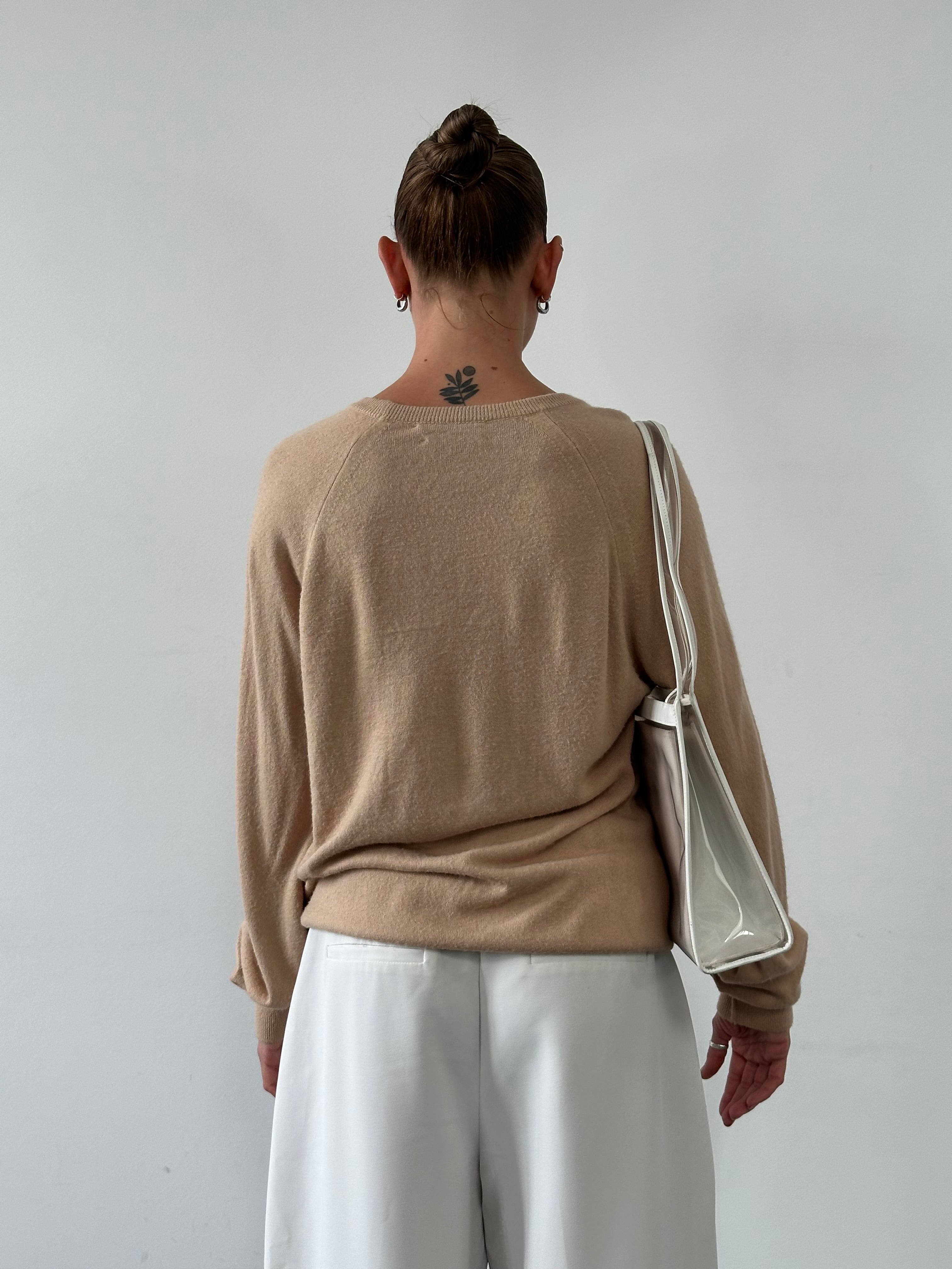 Christian Dior 1980s V-neck logo knitted jumper in size L, featuring classic Dior branding and a cozy knit texture.