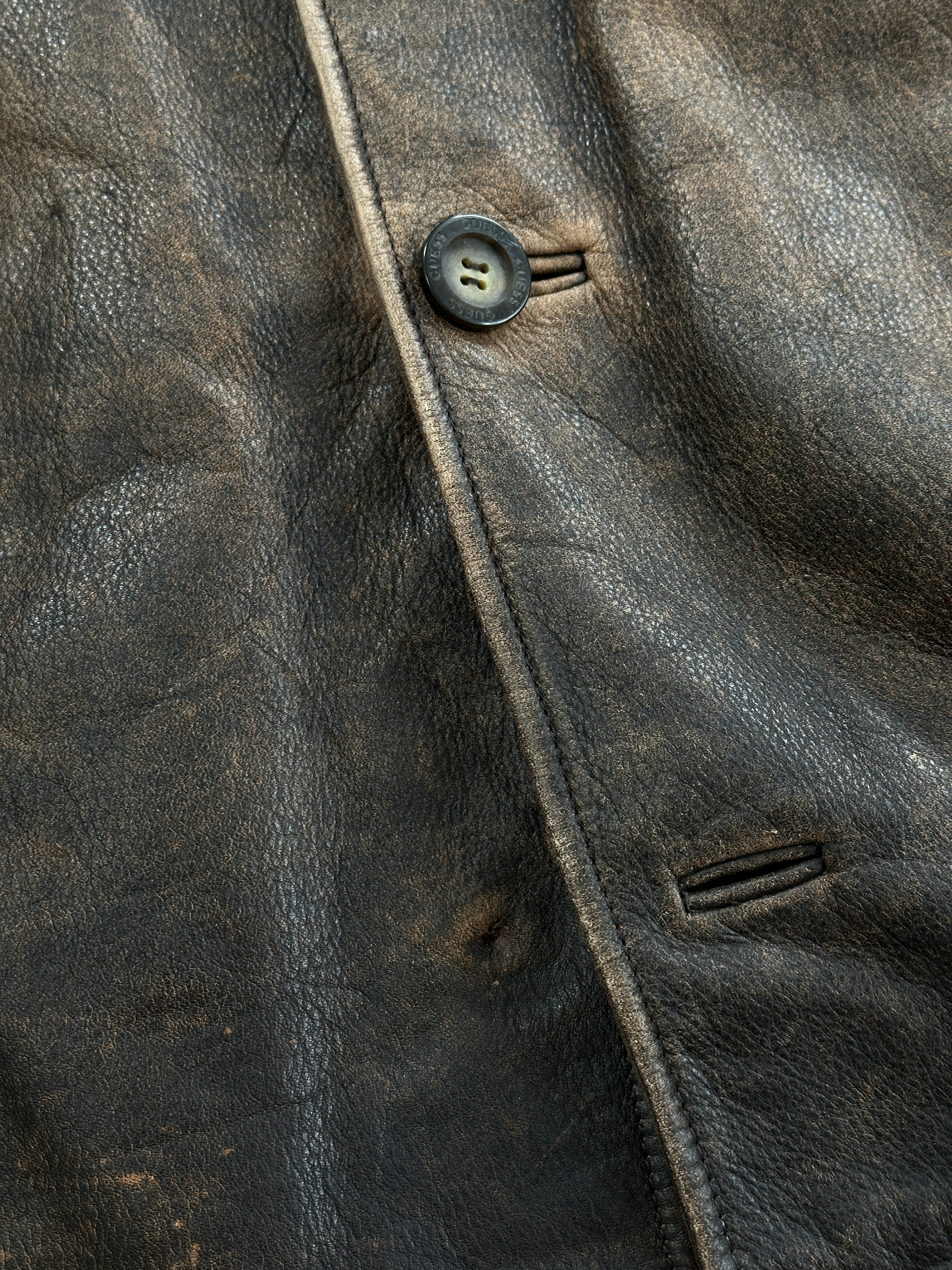 Guess distressed leather jacket in XL, showcasing a rugged, stylish design with visible distressed leather texture.