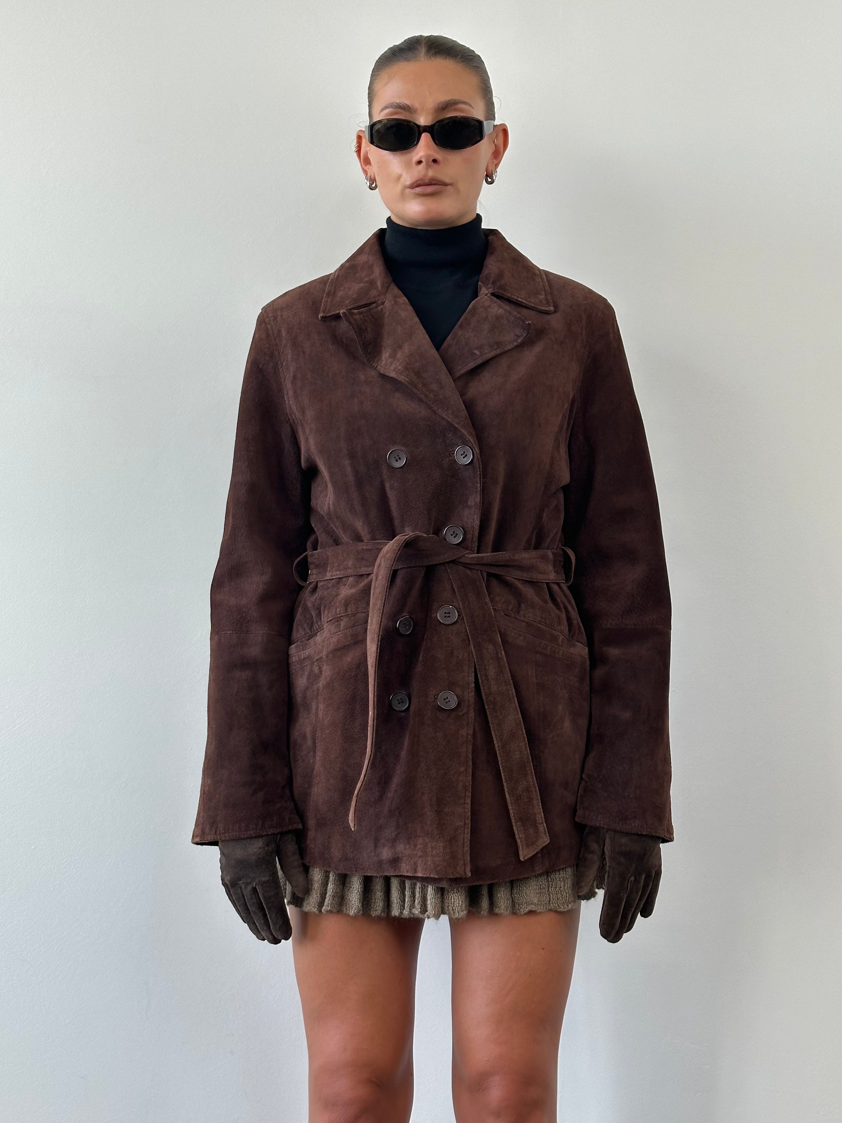 Vintage double-breasted belted suede jacket in size M/L, featuring classic lapels and textured suede fabric.