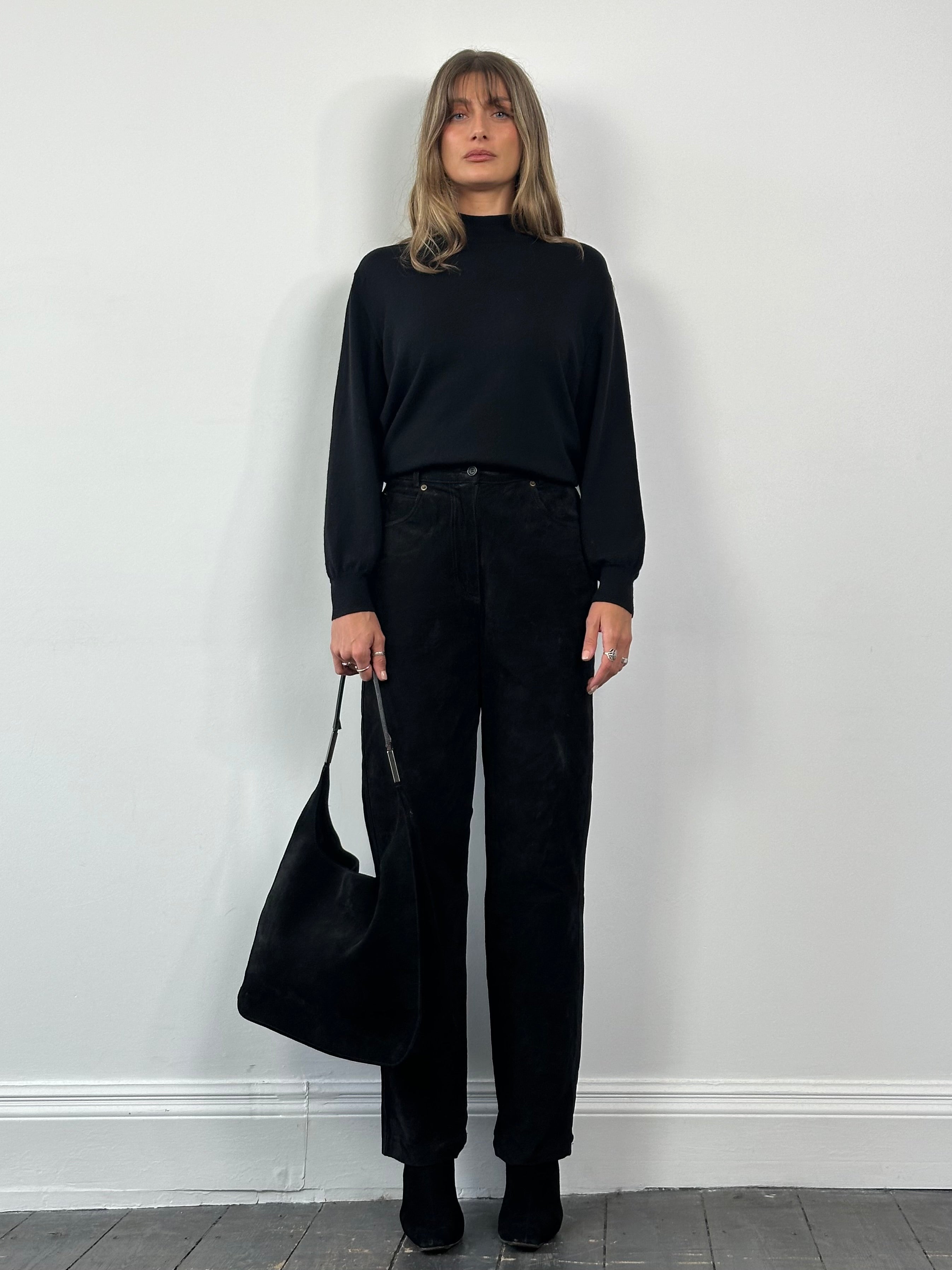 Vintage high waisted suede trousers in W26, featuring a classic fit and rich texture, laid flat on a neutral background.