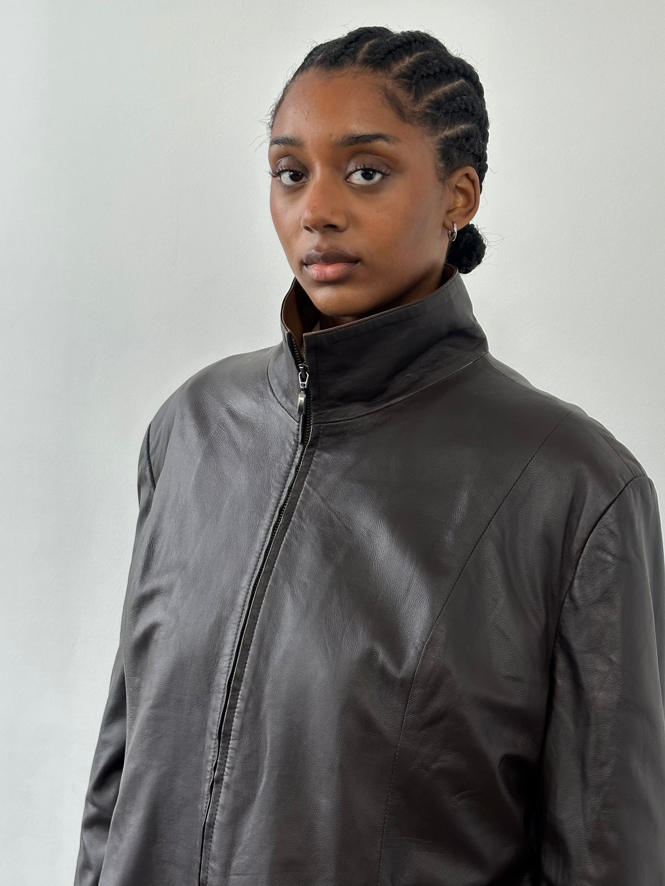 Vintage 1990s high neck leather jacket with contrast details, size XL, classic vintage leather outerwear for a retro look.