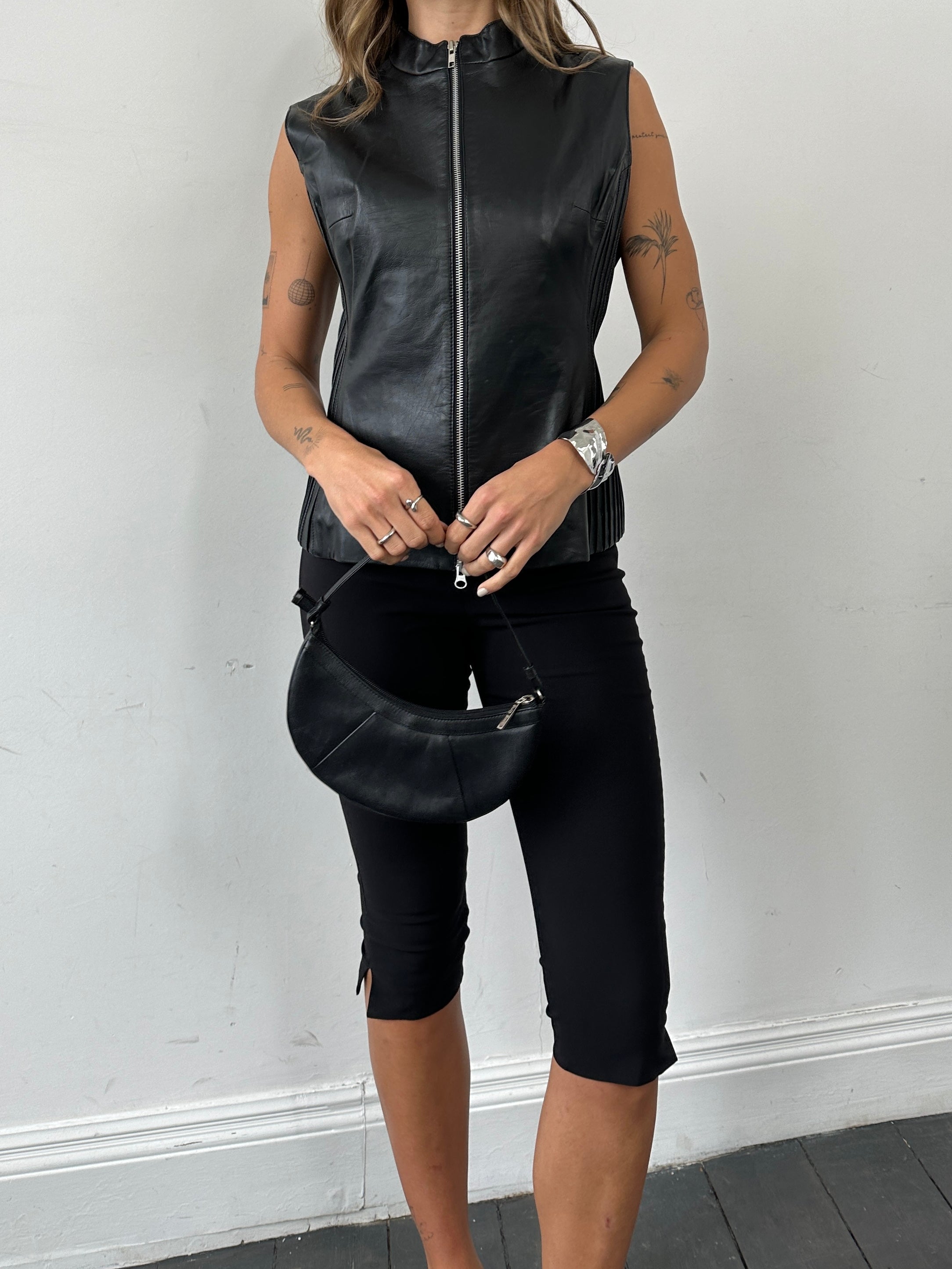 Vintage leather double zip pleated vest jacket, size L, featuring stylish design and multiple zip details, front view.