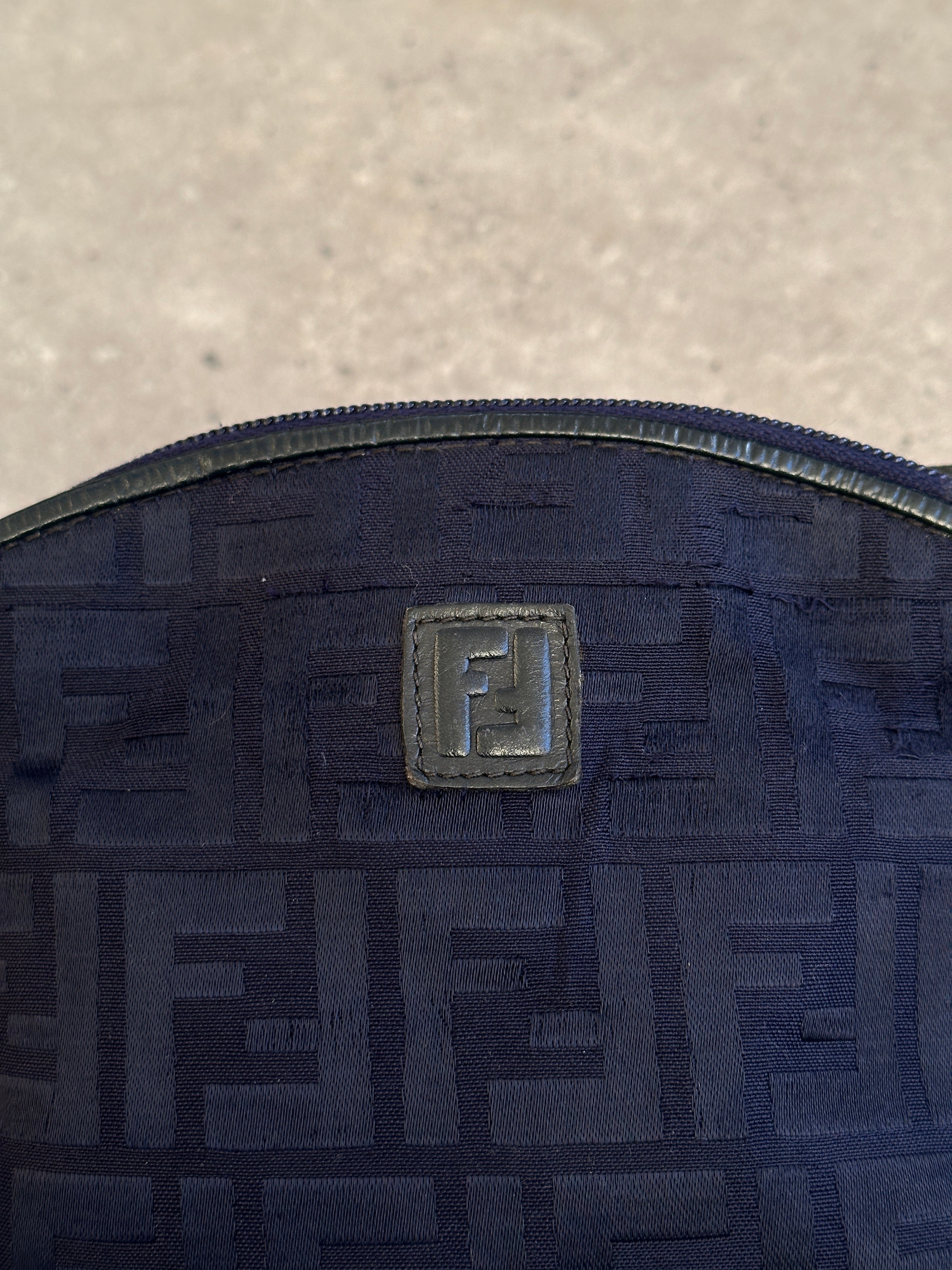 Fendi FF Monogram Crossbody Bag with adjustable strap and gold-tone hardware, featuring the iconic monogram pattern.