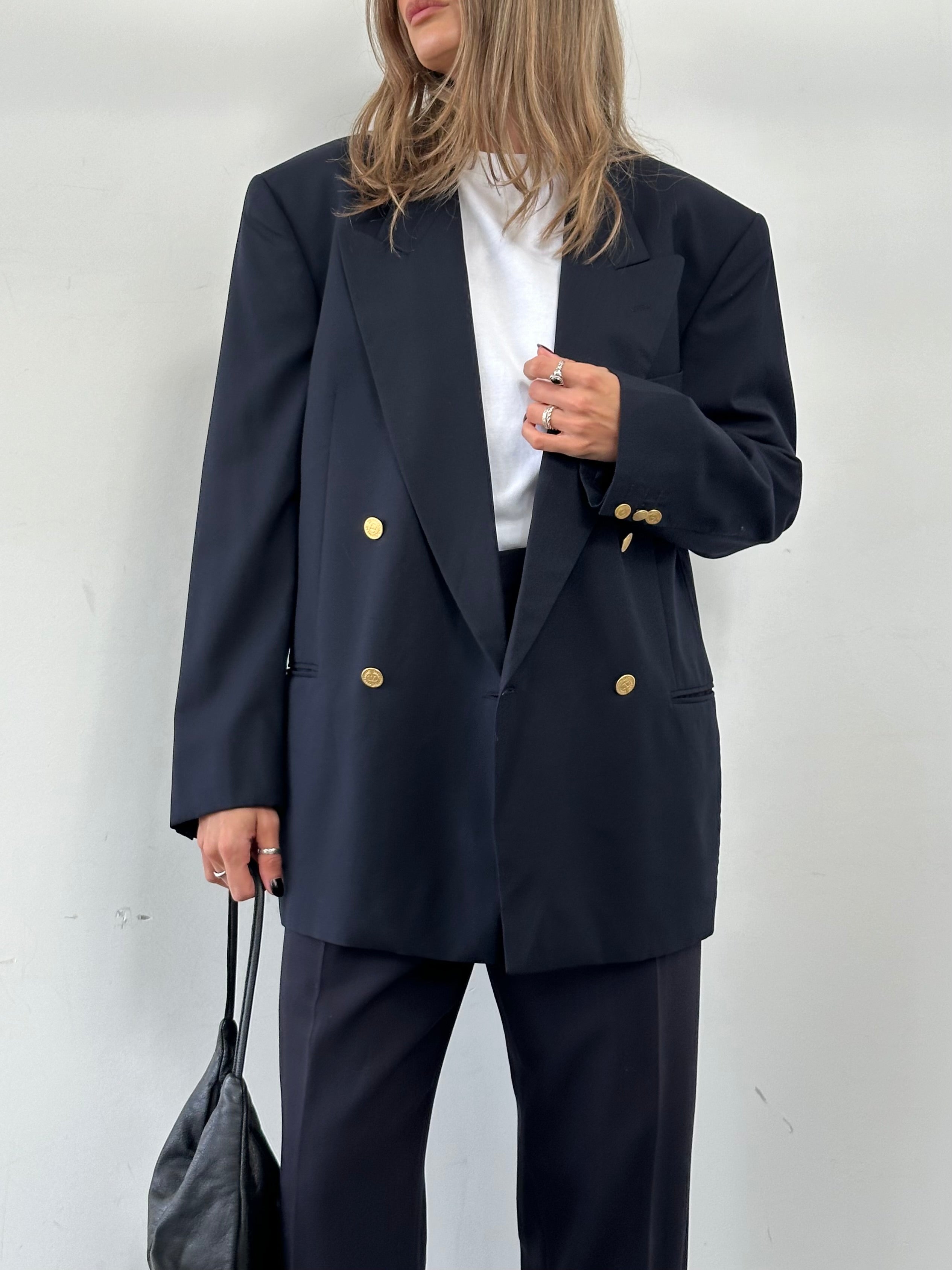 Valentino pure wool double-breasted blazer in size 42R/XL, tailored fit with classic lapel and button details.