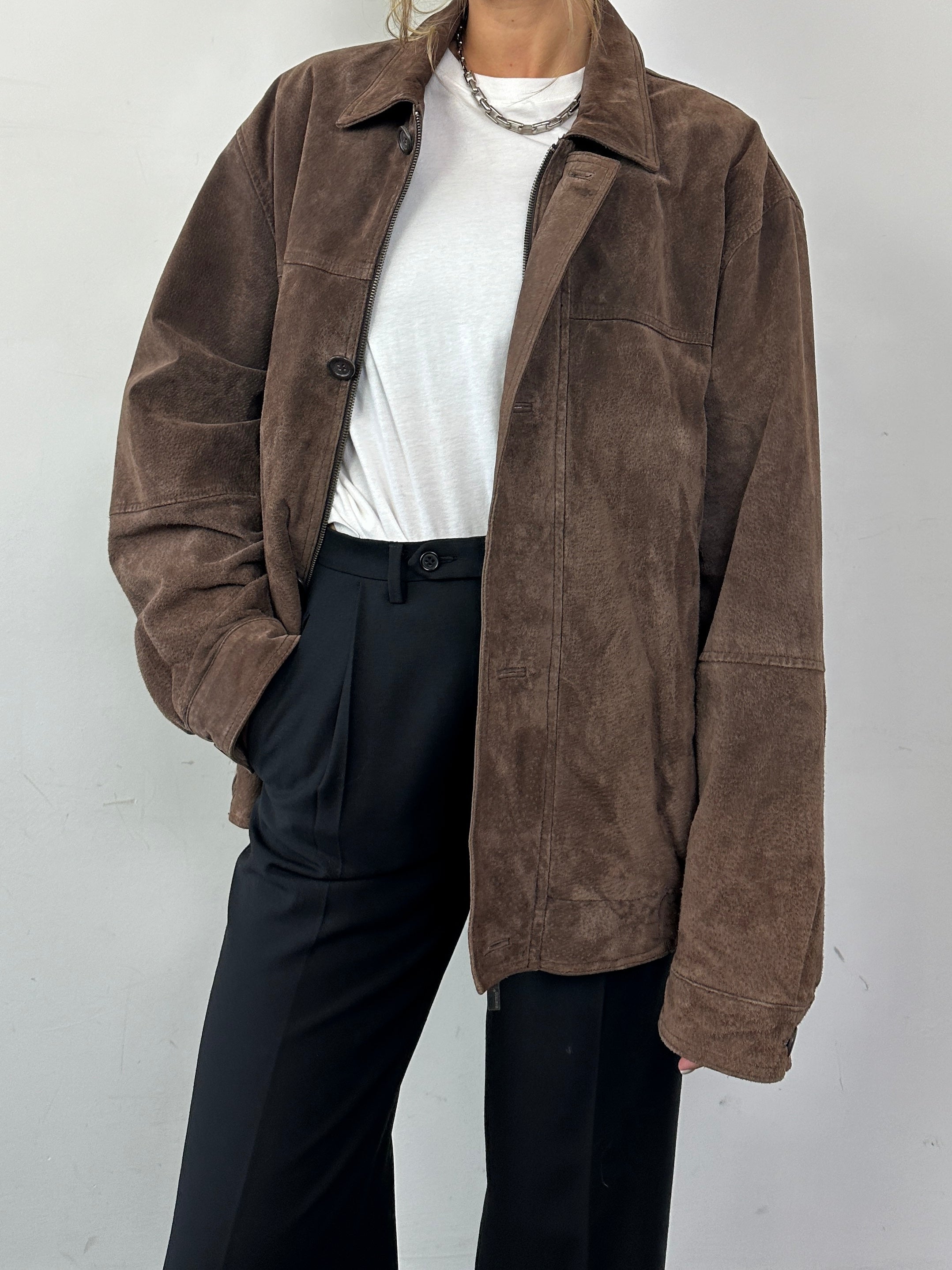 Vintage suede leather bomber jacket in size L, featuring classic design and textured brown suede material.