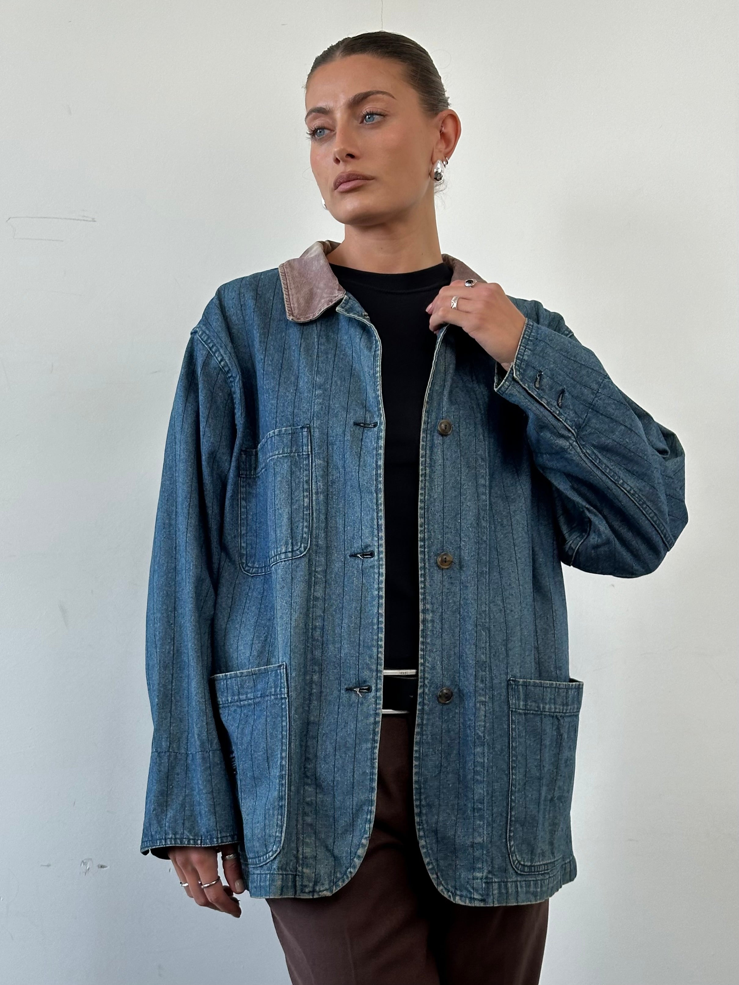 Valentino XL denim workwear jacket with pinstripe design, featuring classic collar and button front, worn by a model.