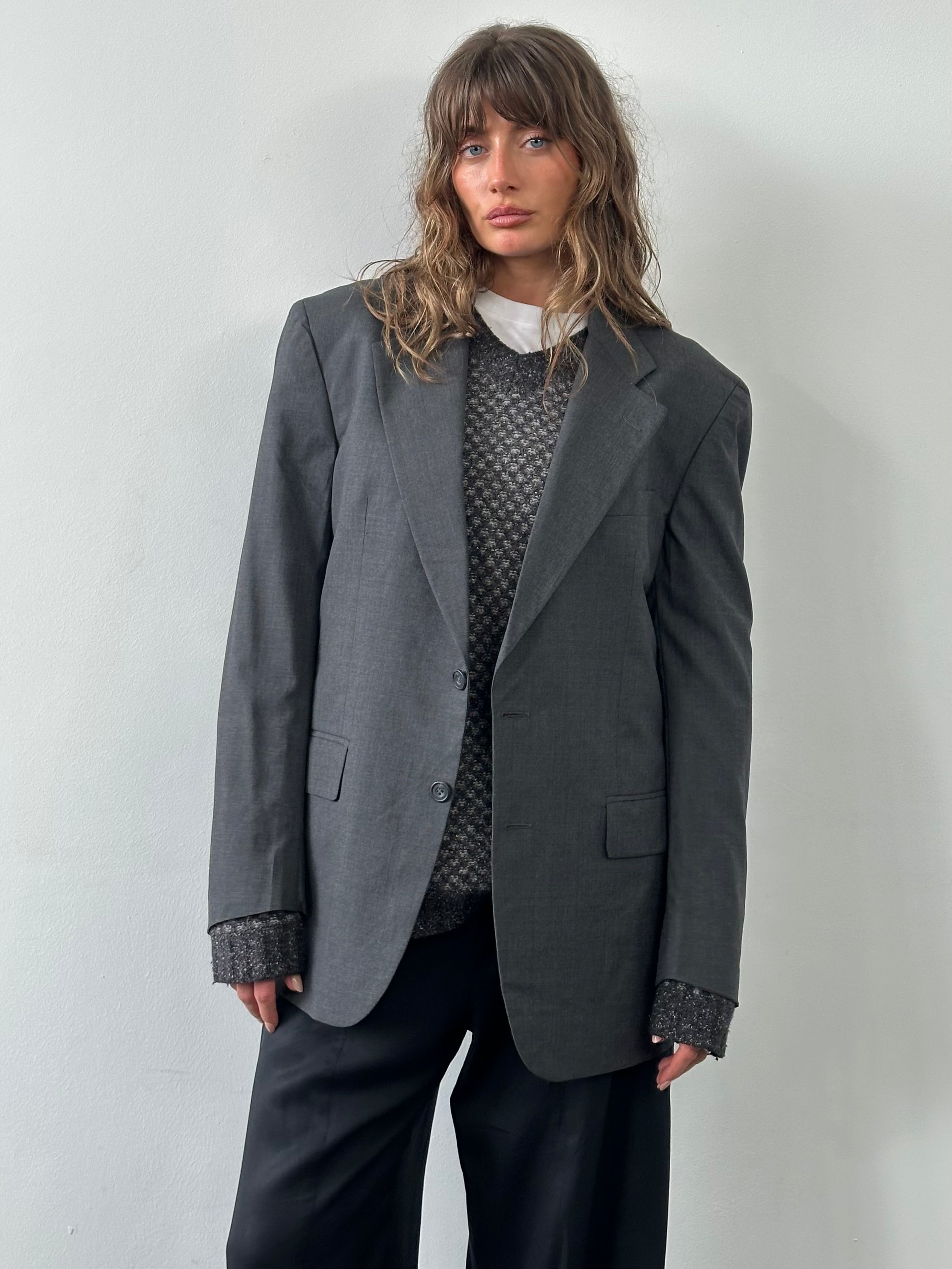 Loro Piana 1990s pure wool single-breasted blazer in size 42R/XL, shown on a hanger with classic tailored fit.