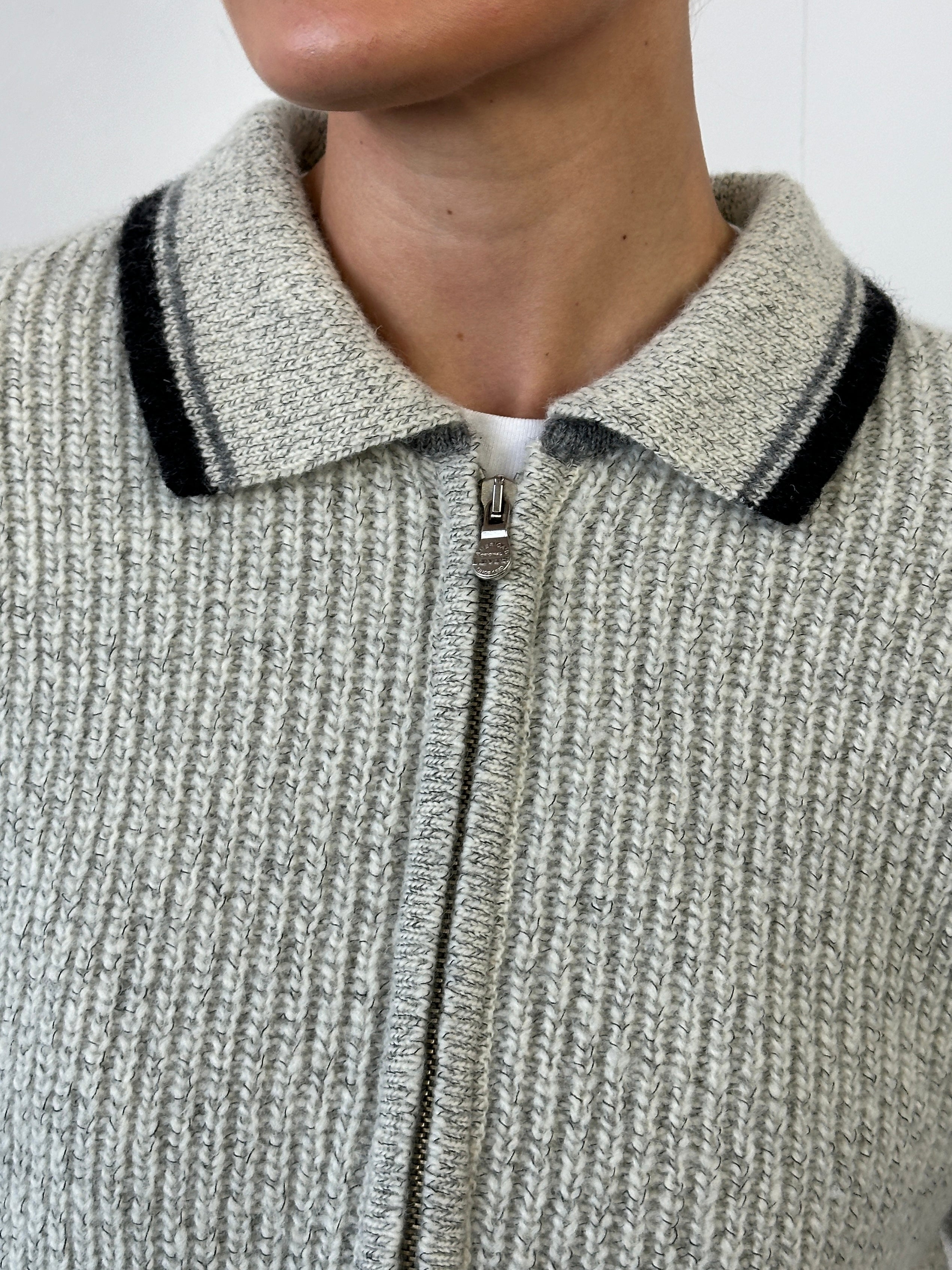 Levi’s wool zip-up knitted cardigan in size large, featuring a cozy, textured knit with a front zipper and ribbed cuffs.