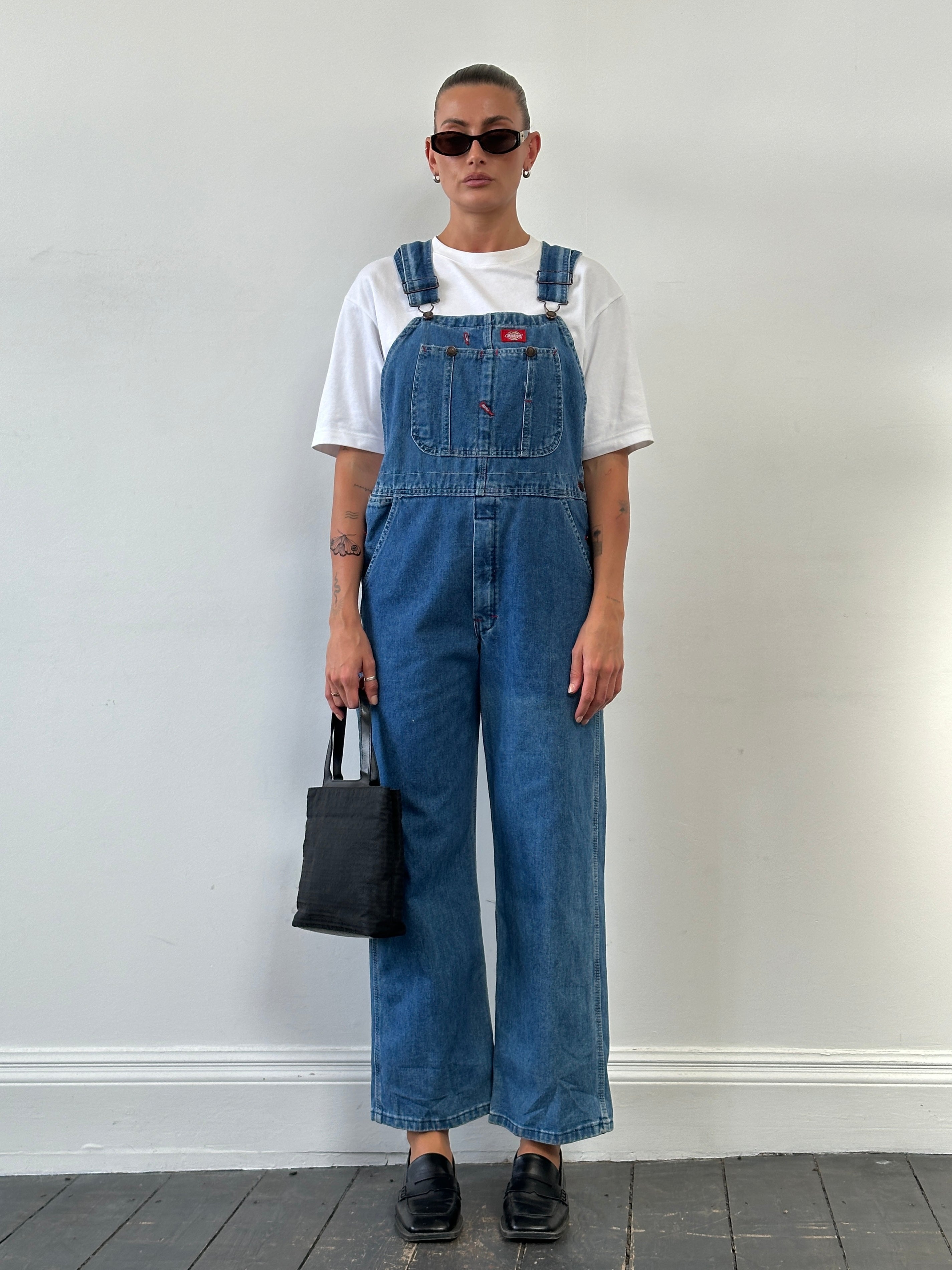 Dickies pure cotton denim dungarees in size M, featuring classic blue denim fabric, front pockets, and adjustable straps.