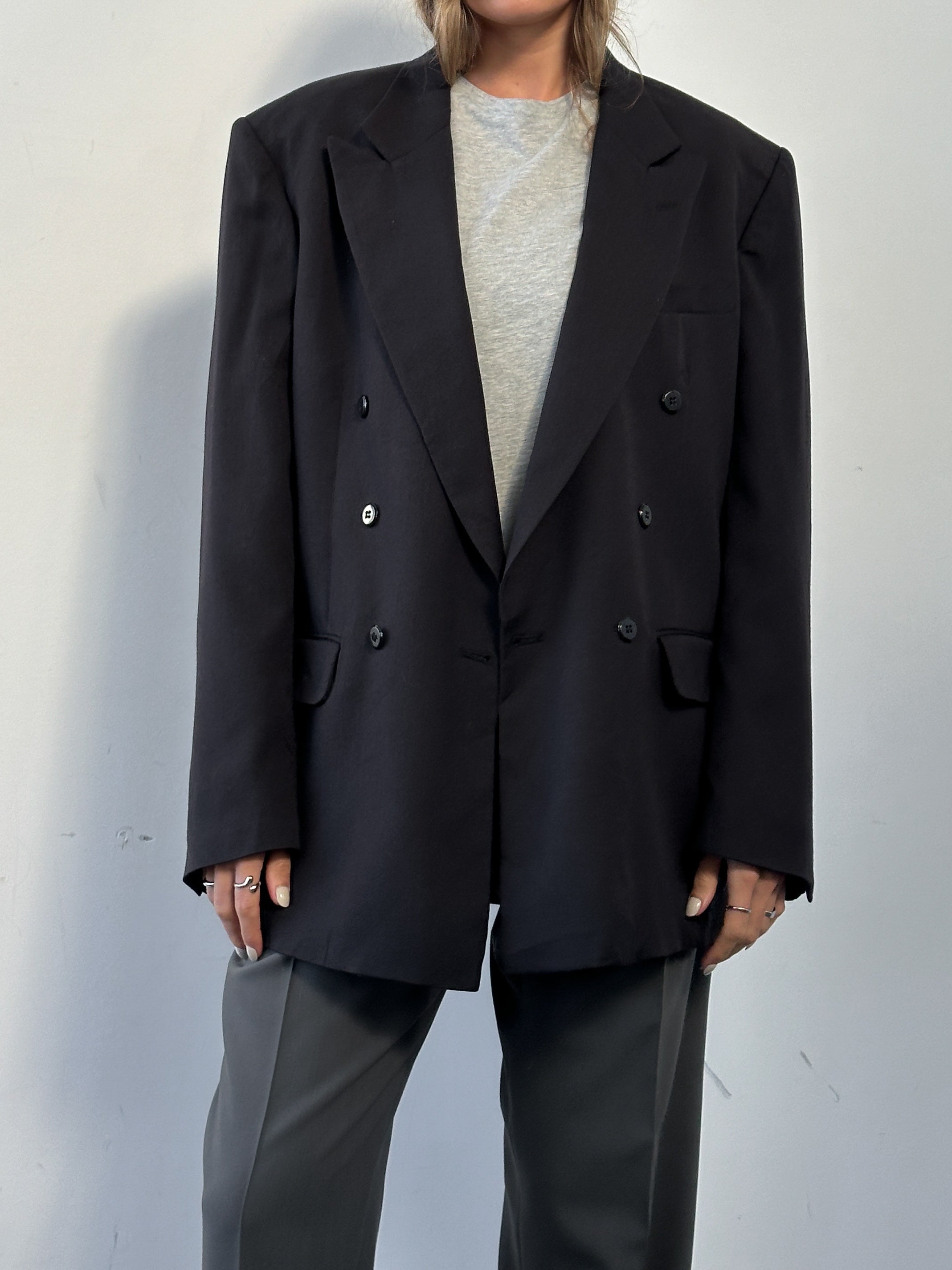 Vintage wool double-breasted blazer in size 40L, tailored fit with classic lapels and button details, perfect for formal or casual wear.