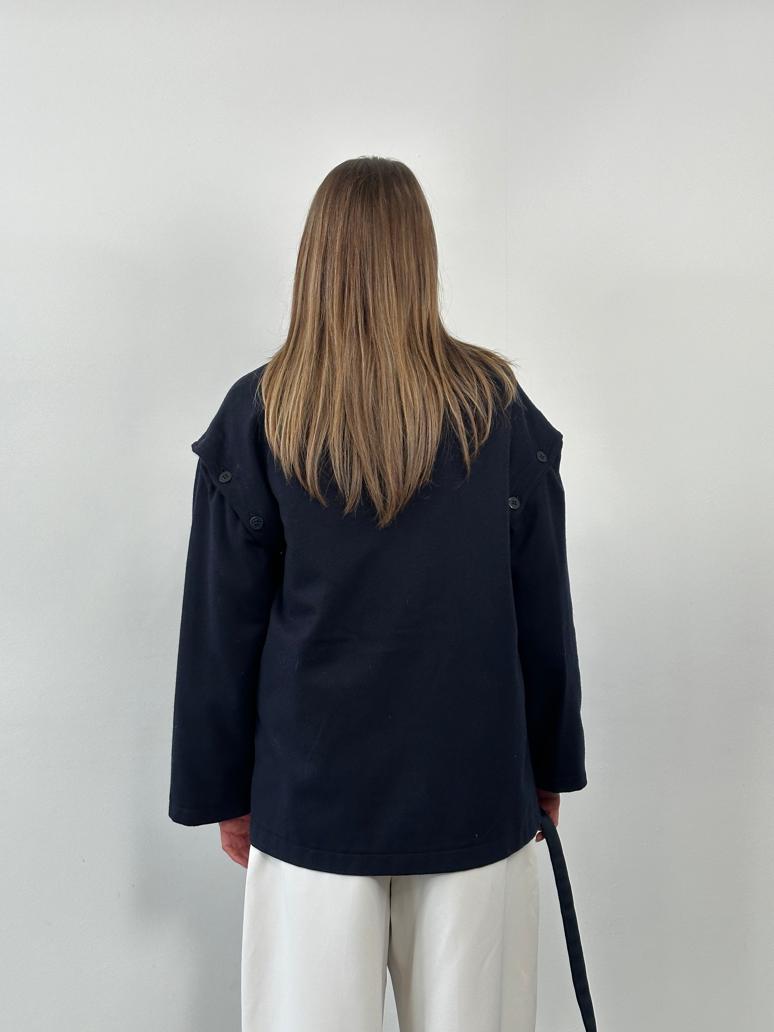 Vintage Italian 1990s wool jacket with detachable sleeves, size L/XL, classic retro style, featuring textured fabric and vintage details.