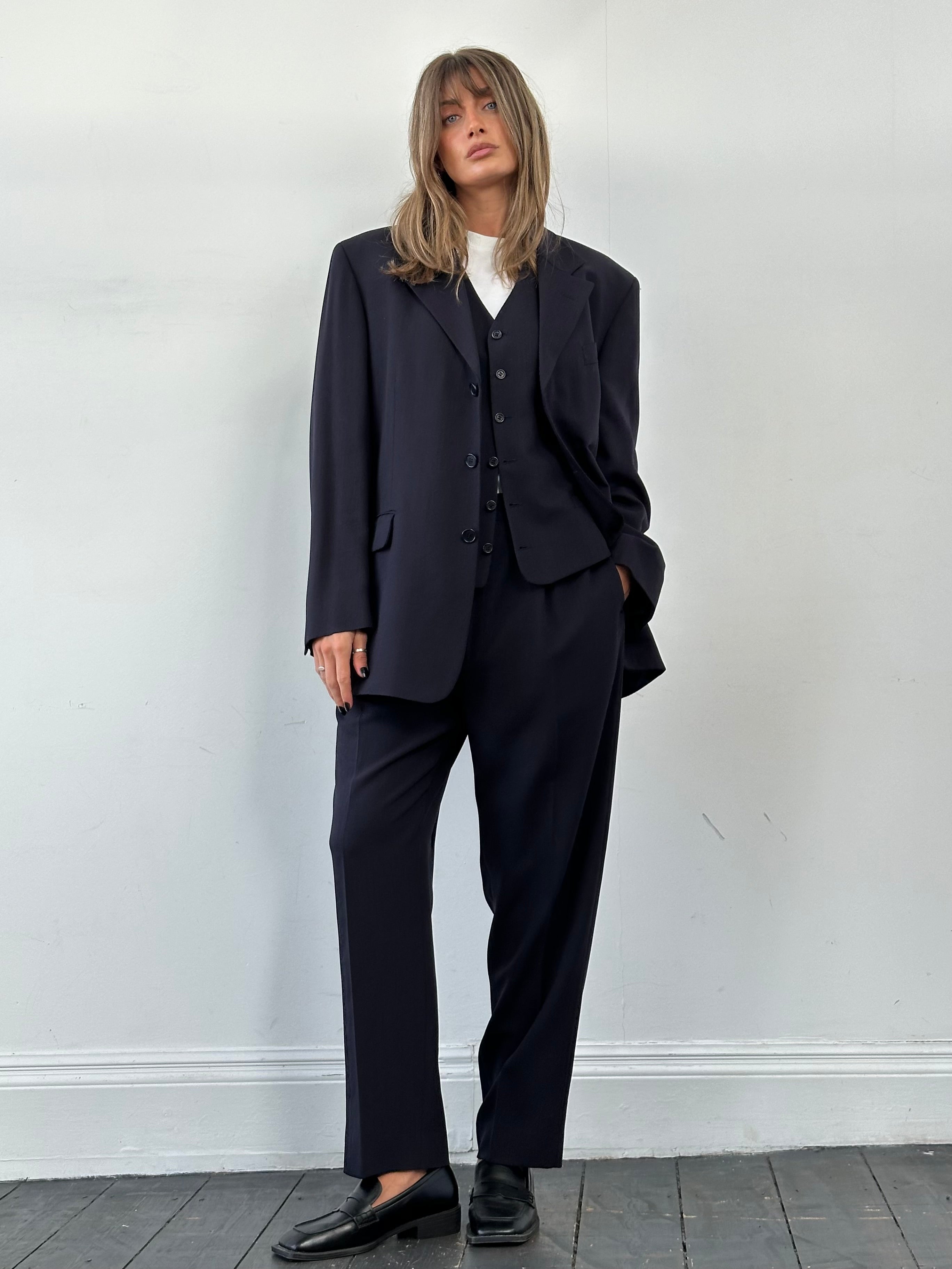 Yves Saint Laurent Pour Homme three-piece wool suit in 44R/W36, tailored with notch lapel jacket, vest, and matching trousers.