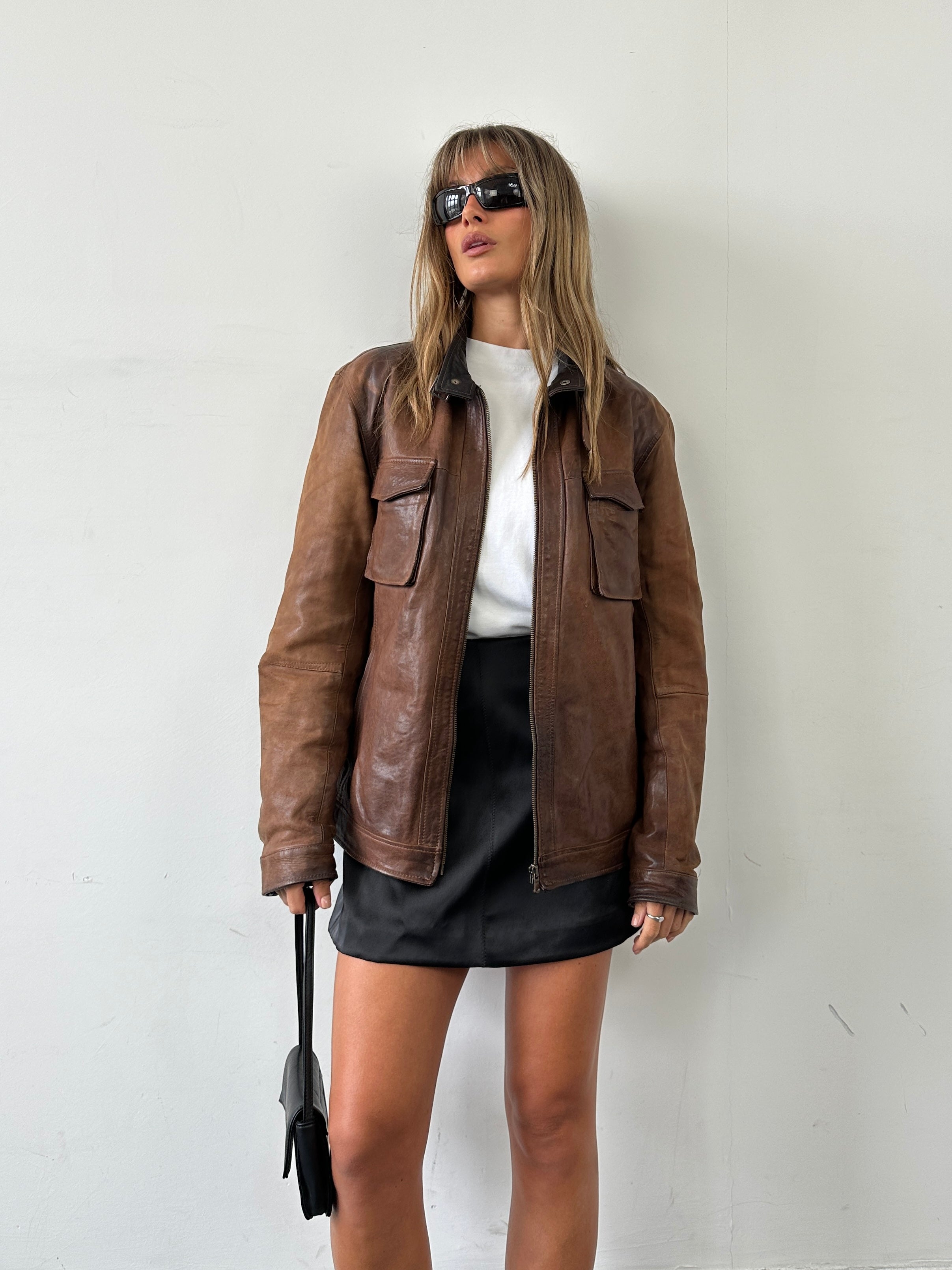 Vintage Italian vintage aged leather jacket, size L, showcasing classic design and rich leather texture.
