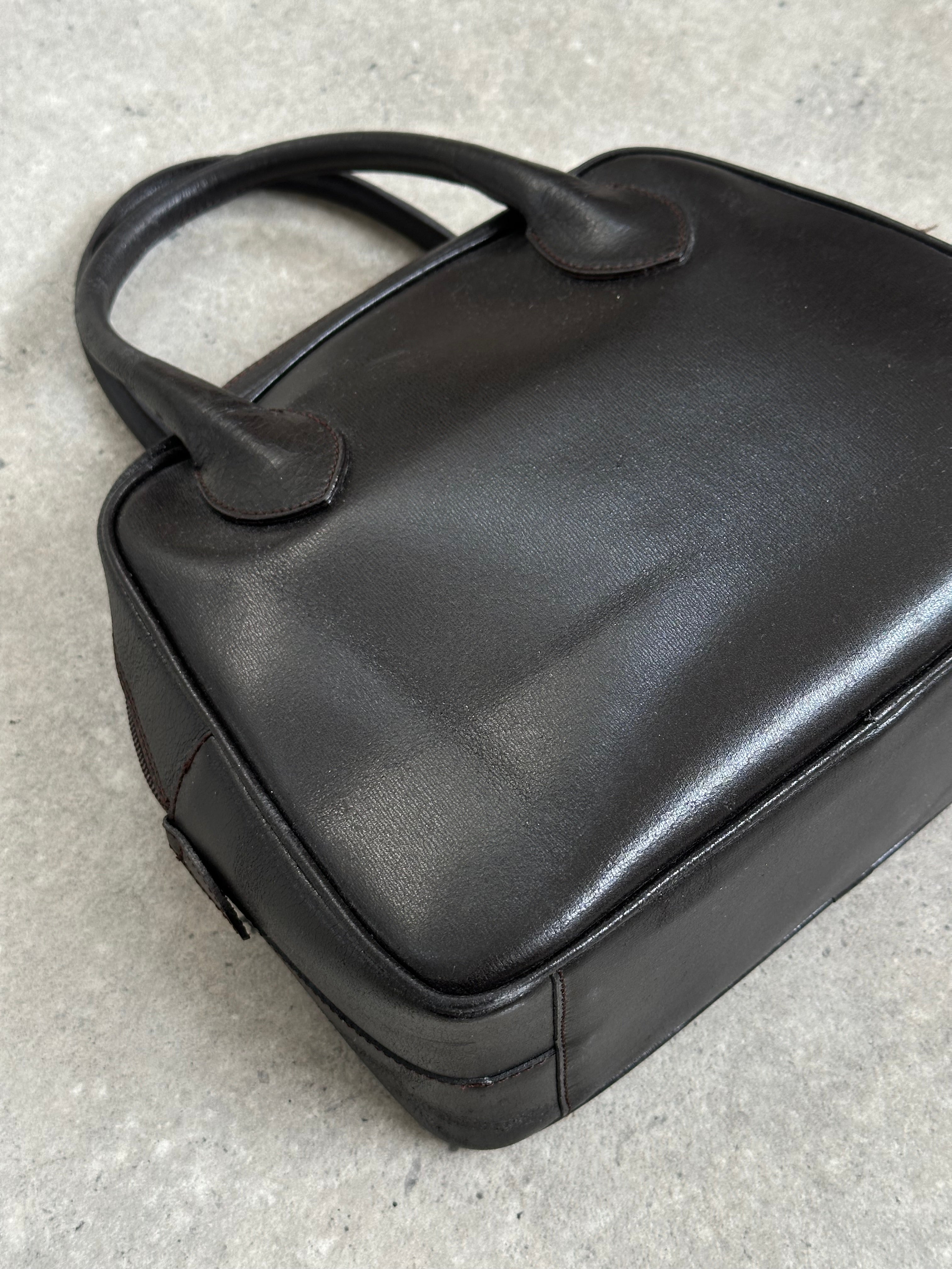 Emporio Armani leather handbag from the 2000s in black with sleek design, featuring a top handle and subtle branding.