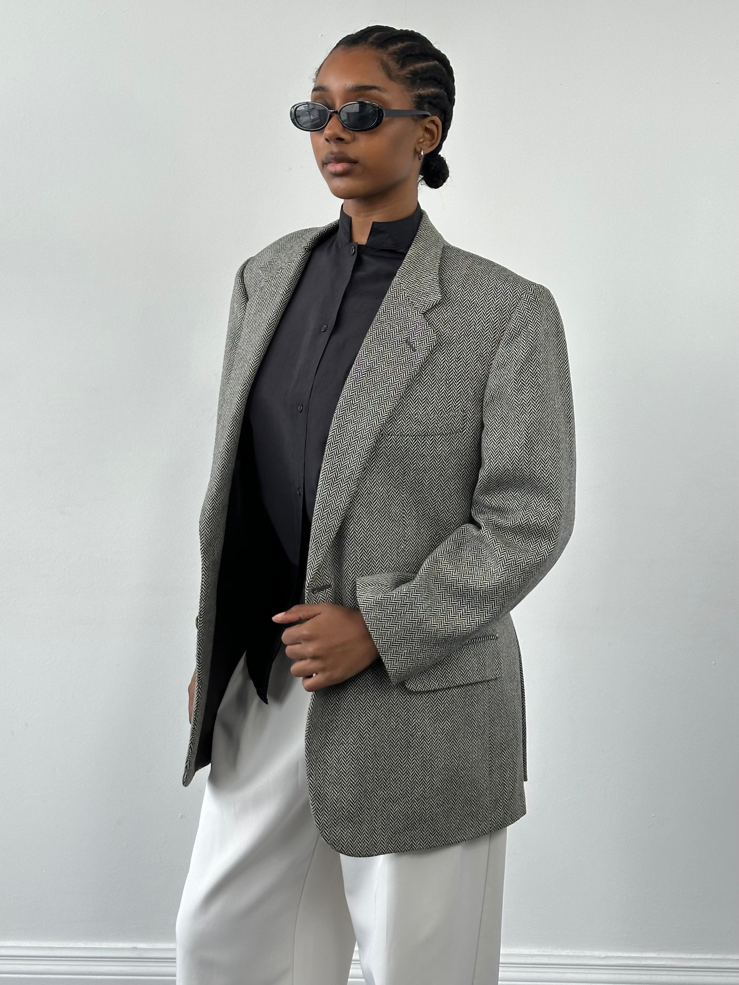 Burberry 1990s herringbone wool blazer, single-breasted, in size 42R/L, featuring classic tailored design and signature check lining.