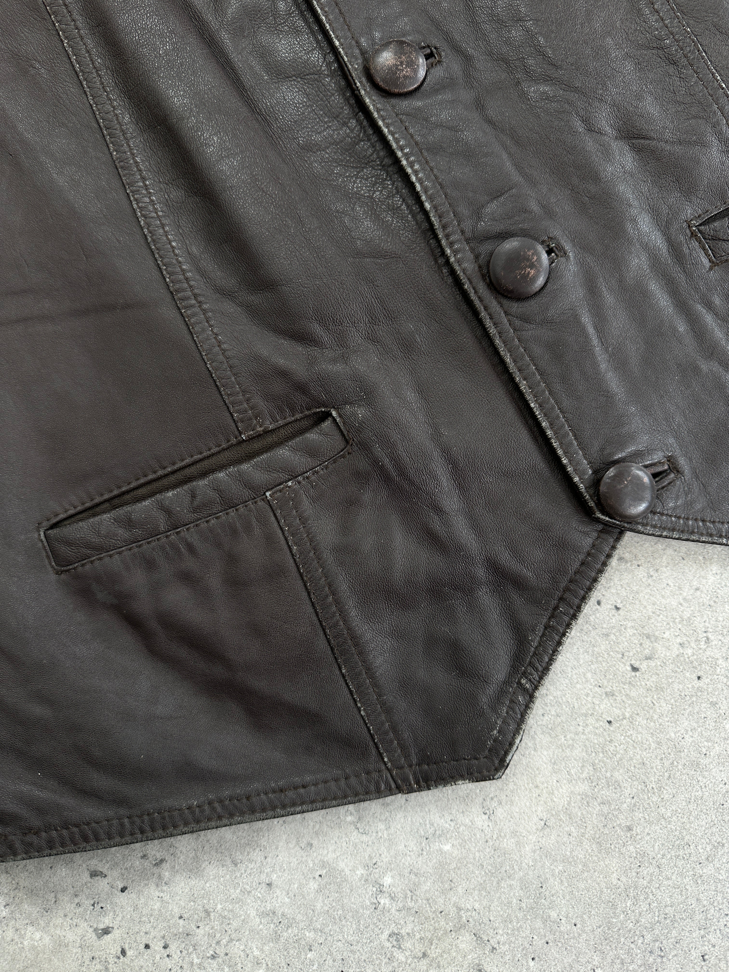 Vintage 1990s leather waistcoat in XL size, classic sleeveless design with button closures and distressed leather finish.