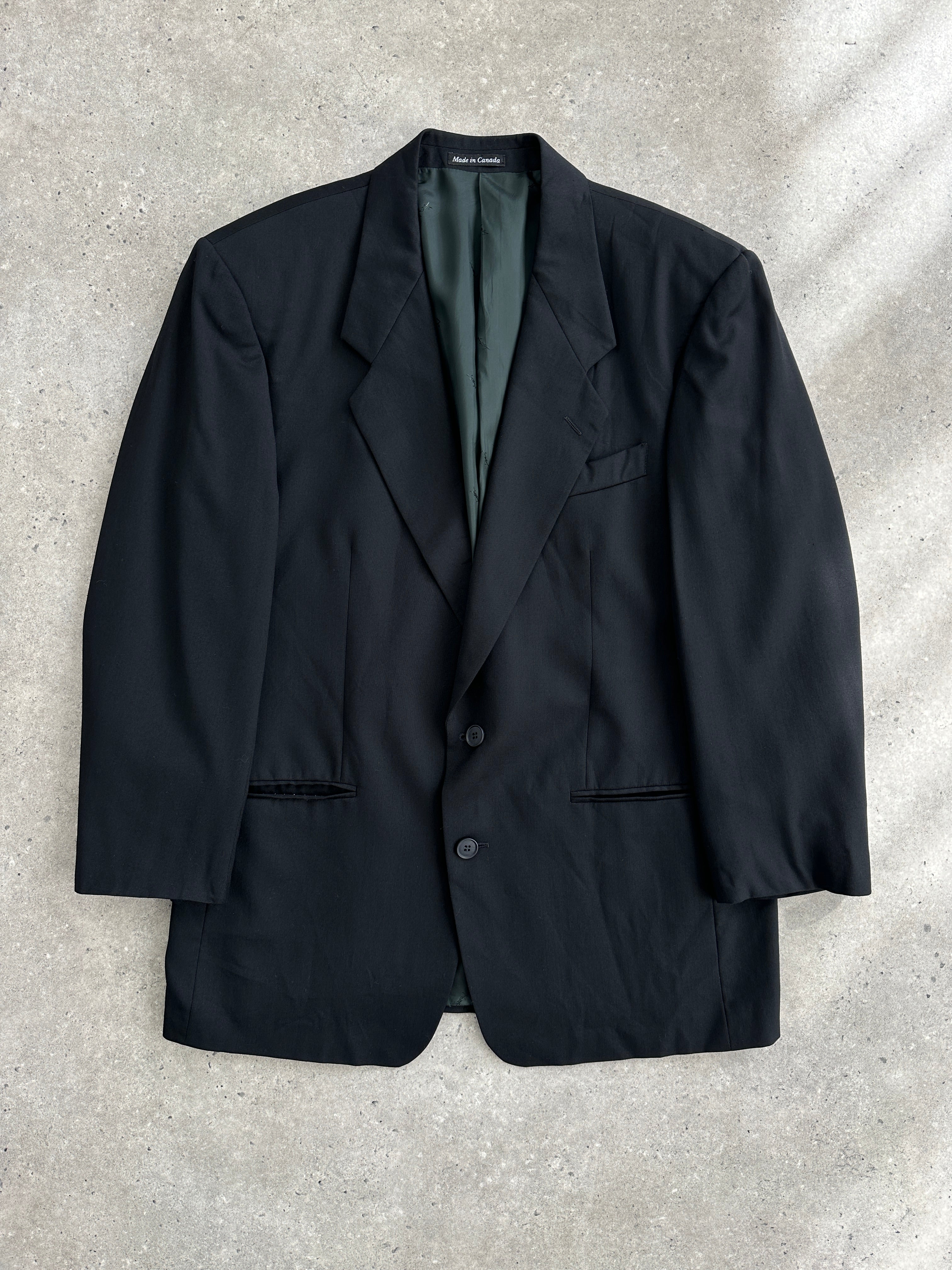 Yves Saint Laurent 90s pure wool single-breasted blazer in size 44R/L, with classic lapel and tailored fit.