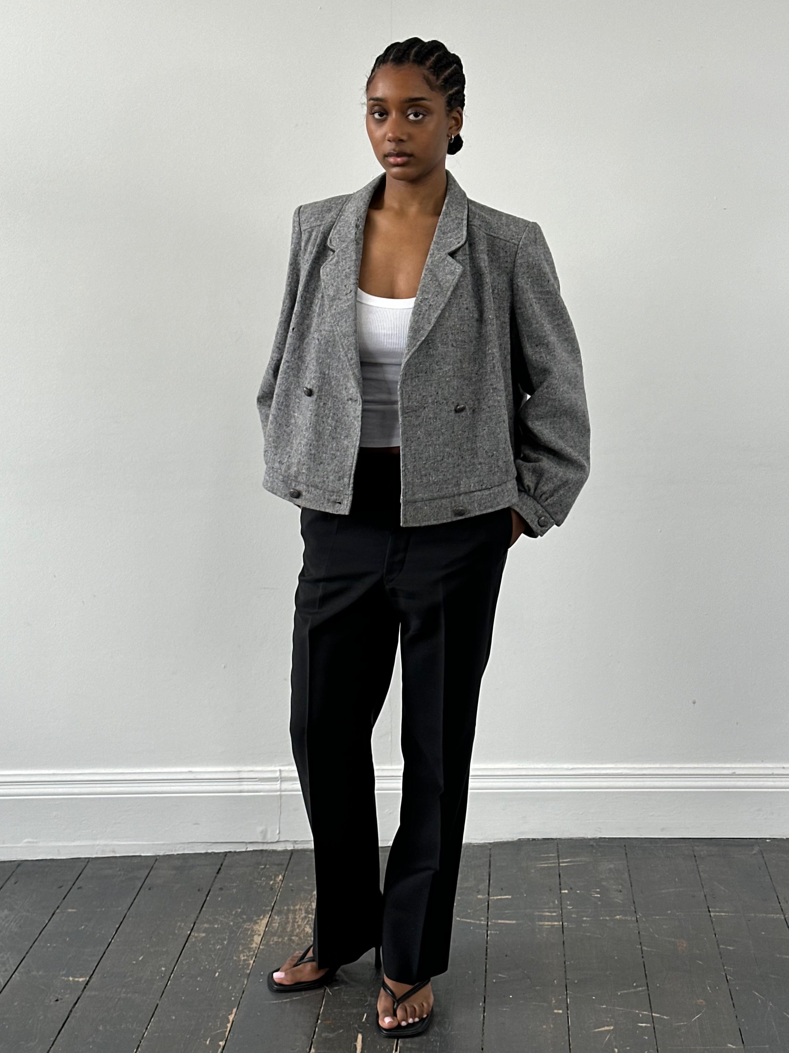 British vintage 1980s pure wool bomber jacket in size M, with classic design and textured wool fabric.