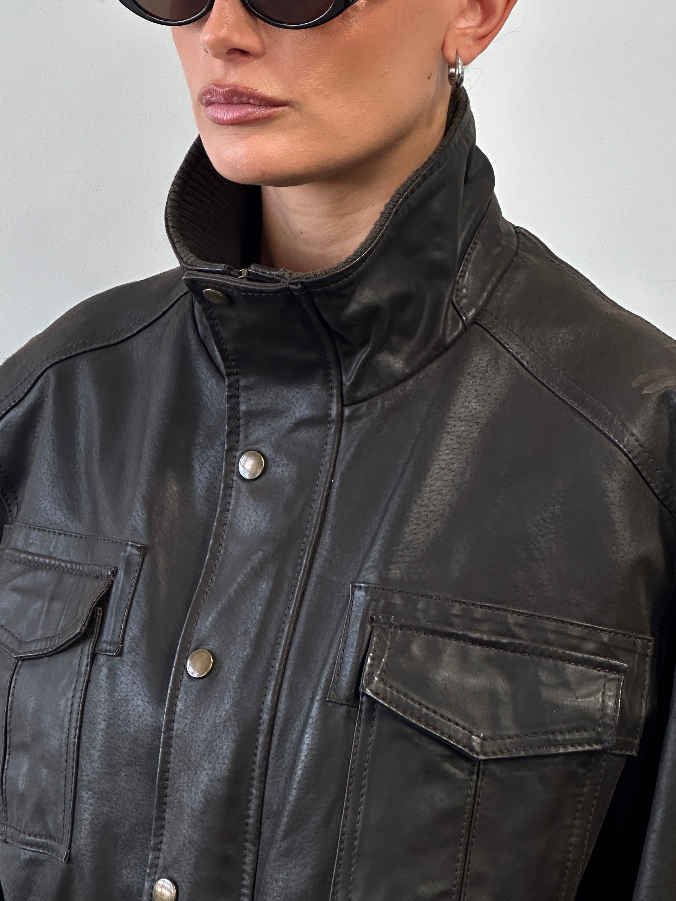 Vintage high neck leather jacket in size XL, featuring classic design and premium leather material.