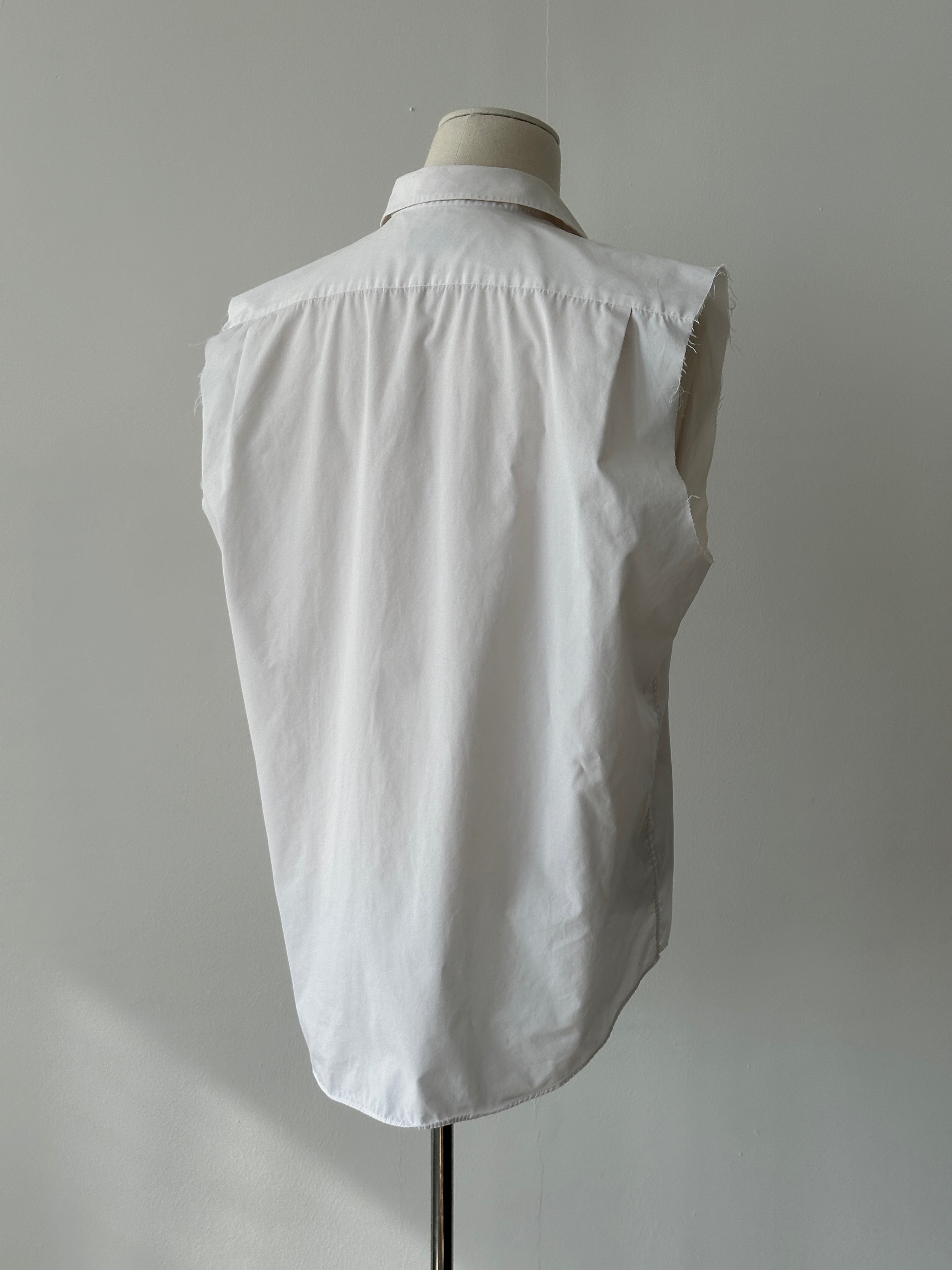 Yves Saint Laurent 2000s cotton sleeveless logo shirt in size L, white with YSL branding on the front.