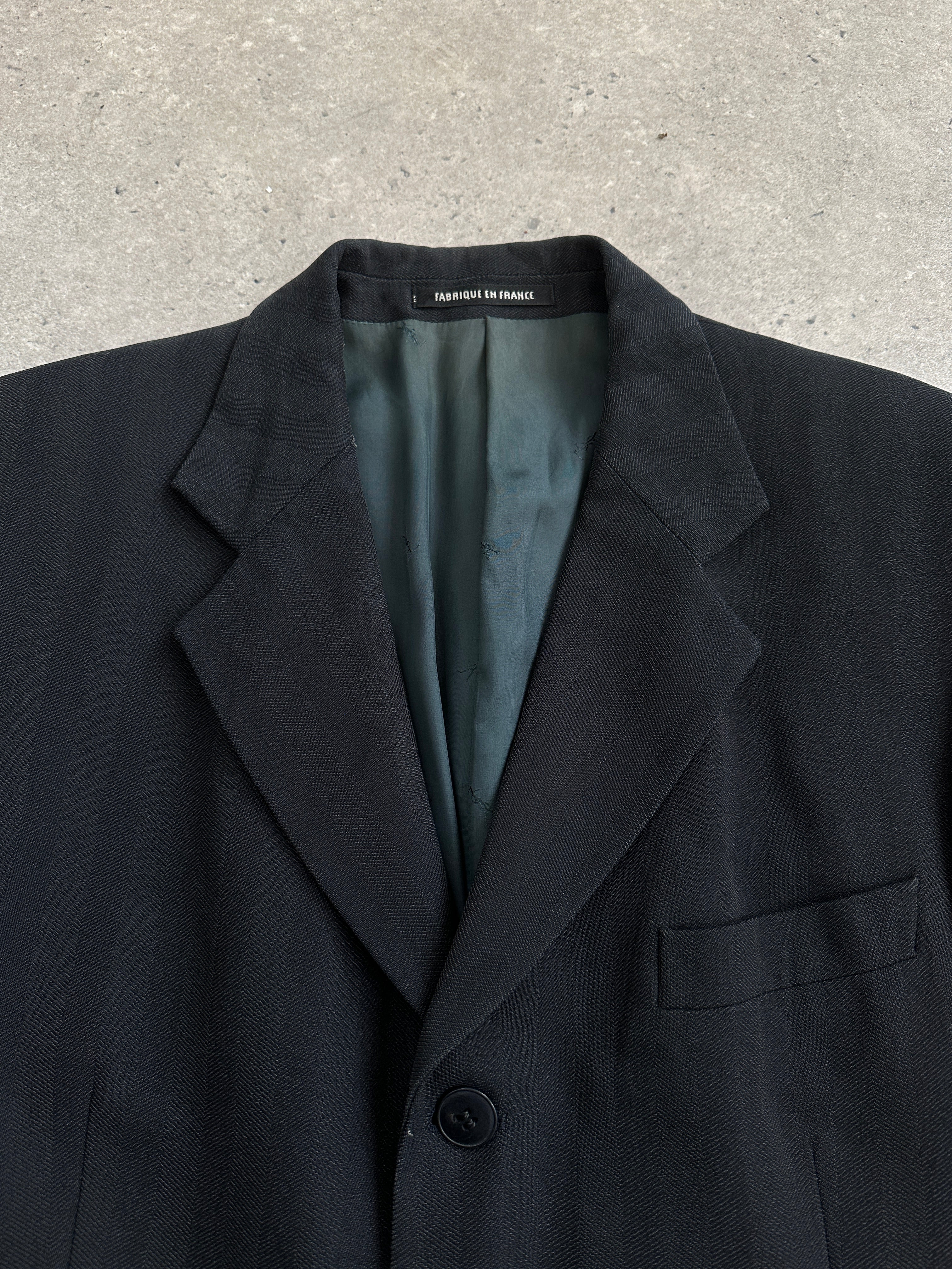 Yves Saint Laurent Pour Homme 1990s wool single-breasted blazer in size 40R/L, tailored fit with classic lapel and button closure.