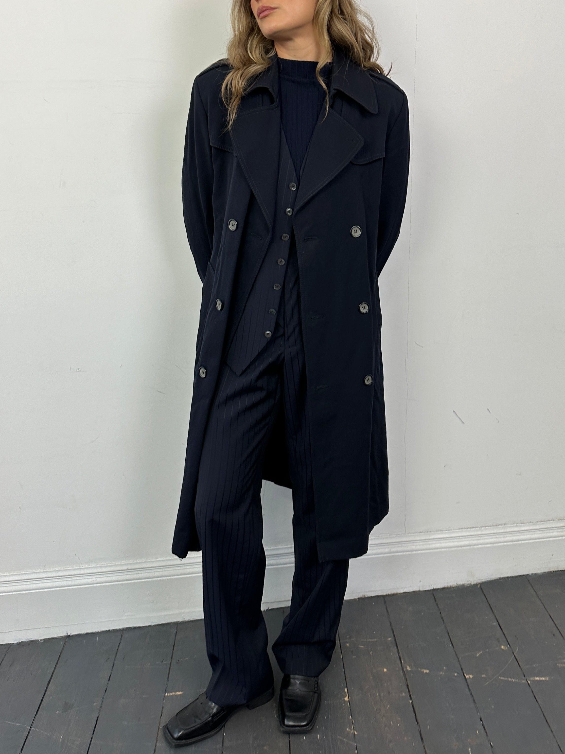 Vintage wool double-breasted belted trench coat in size small, featuring classic design and tailored fit.