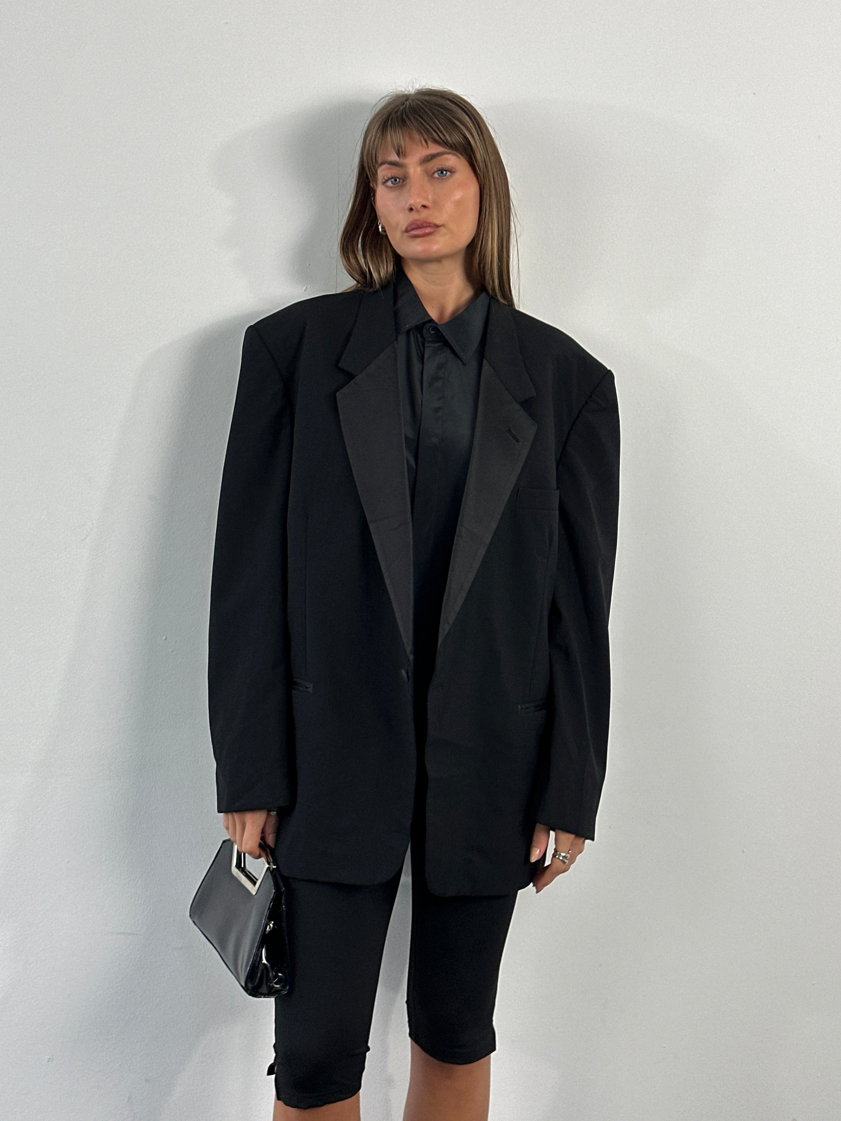 Christian Dior Le Connaisseur 1990s pure wool tuxedo blazer in size 46R/XXL, tailored fit with peak lapels and classic black color.