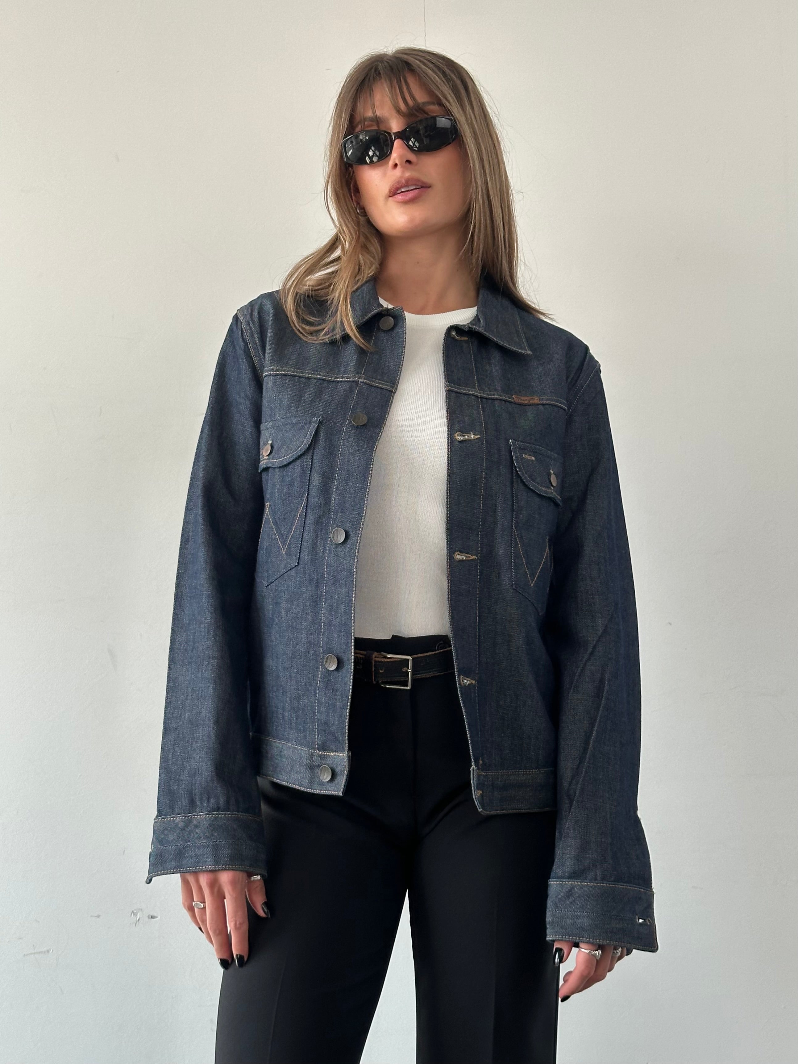 Wrangler organic cotton denim jacket in size small/medium, featuring classic blue denim with button closures and chest pockets.