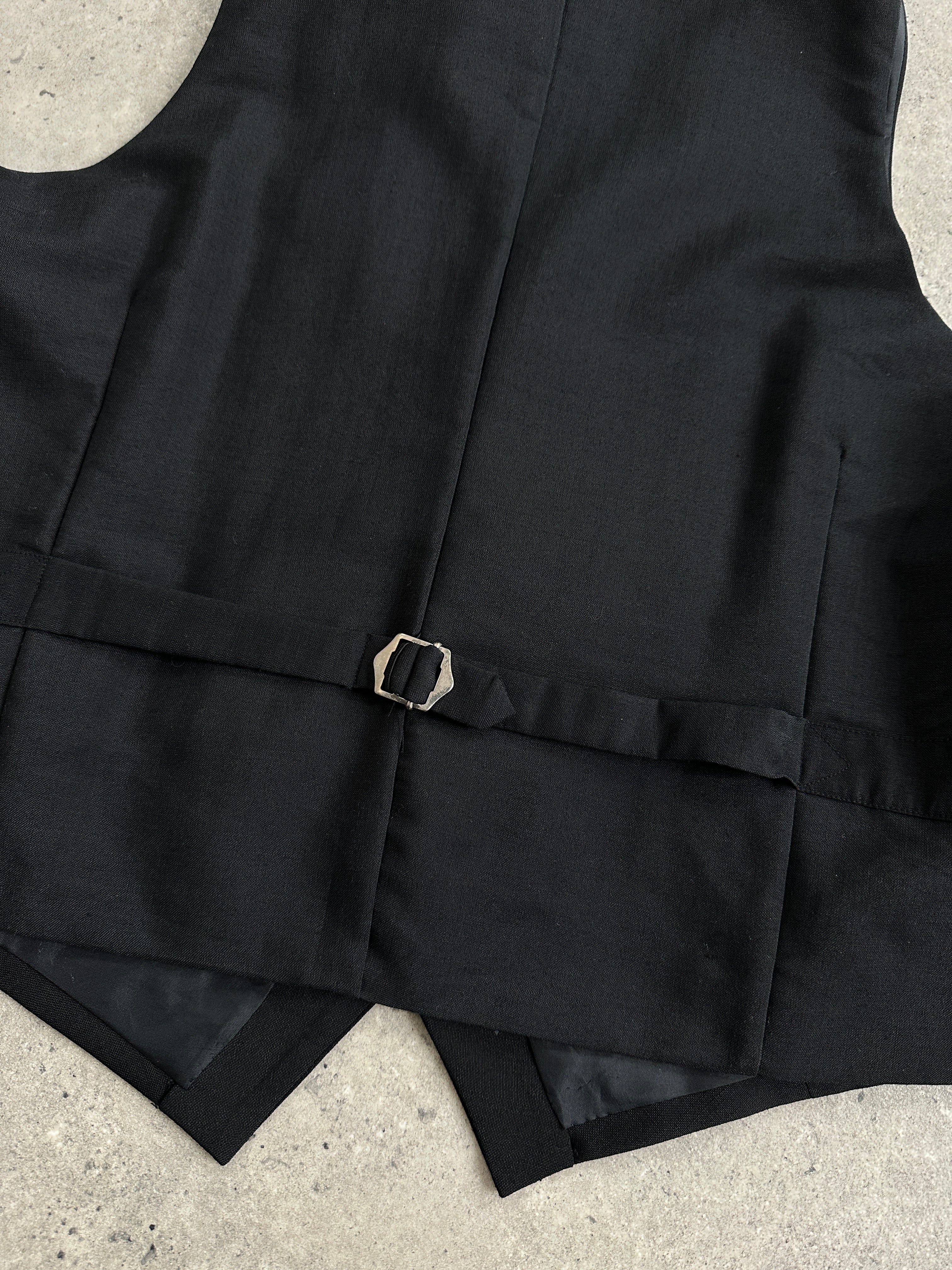 Vintage pure wool tailored waistcoat in size L, featuring classic design with button closure and a timeless style.