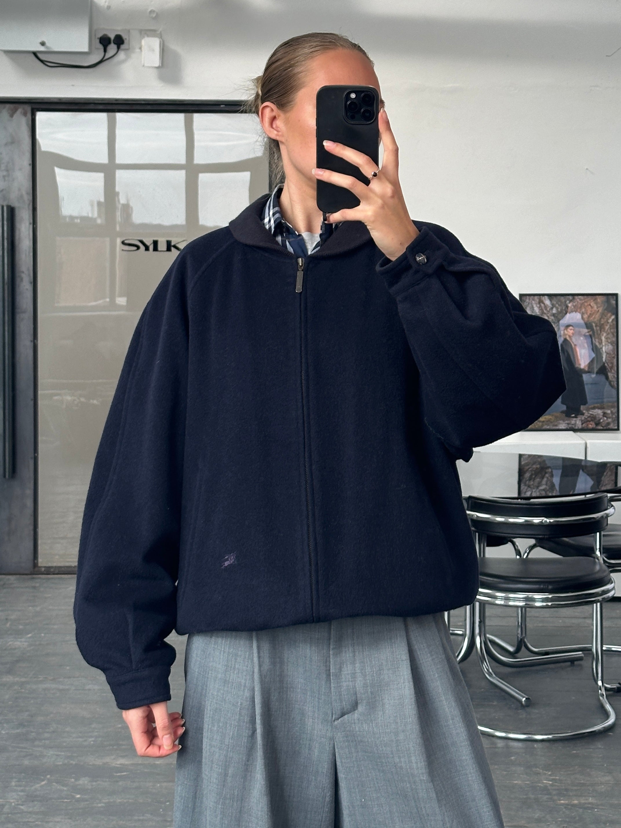 Burberry 1990s pure wool check logo bomber jacket in black, beige, and red with ribbed cuffs and collar, L/XL size.