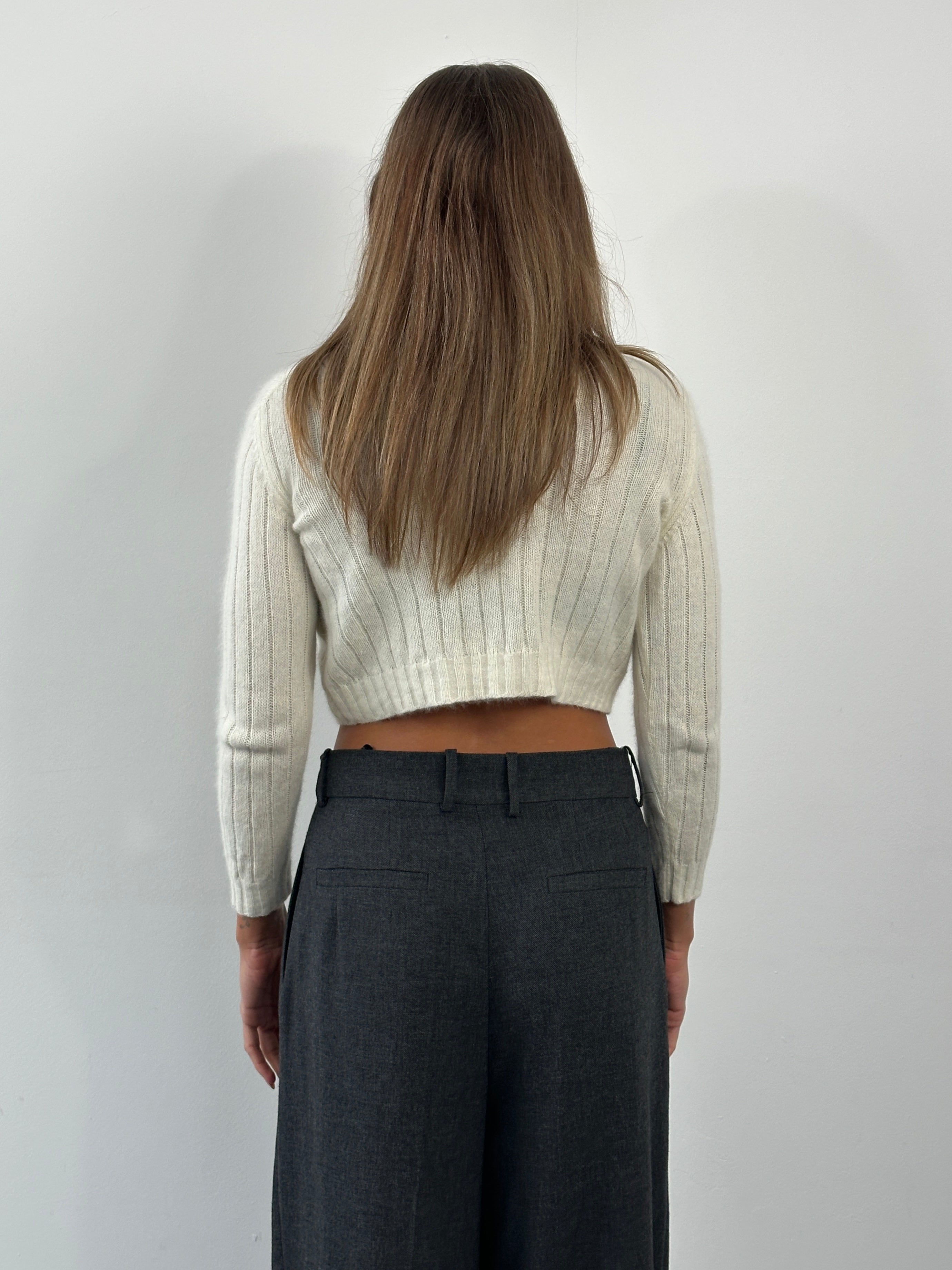 Vintage 1990s angora wool cropped jumper in soft pastel with long sleeves and ribbed hem, showcasing a cozy, retro style.